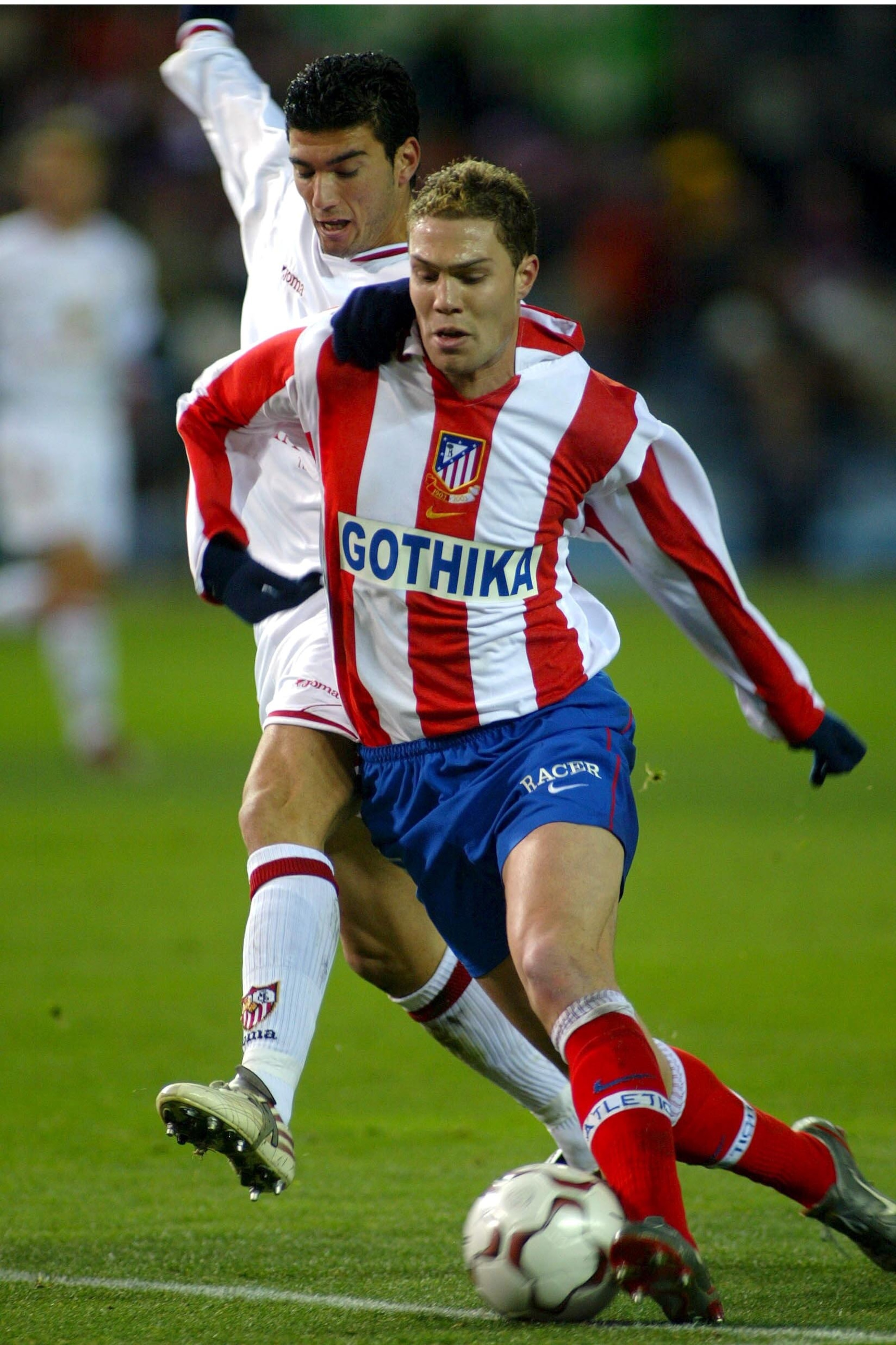 MADRID, SPAIN - JANUARY 18:  Nano of Atletico Madrid (R) in action during the game between At. Madrid and Sevilla of Primera Division Liga played at Vicente Calderon stadium on January 18, 2004 in Madrid, Spain. (Photo by Firo Foto/Getty Images)
