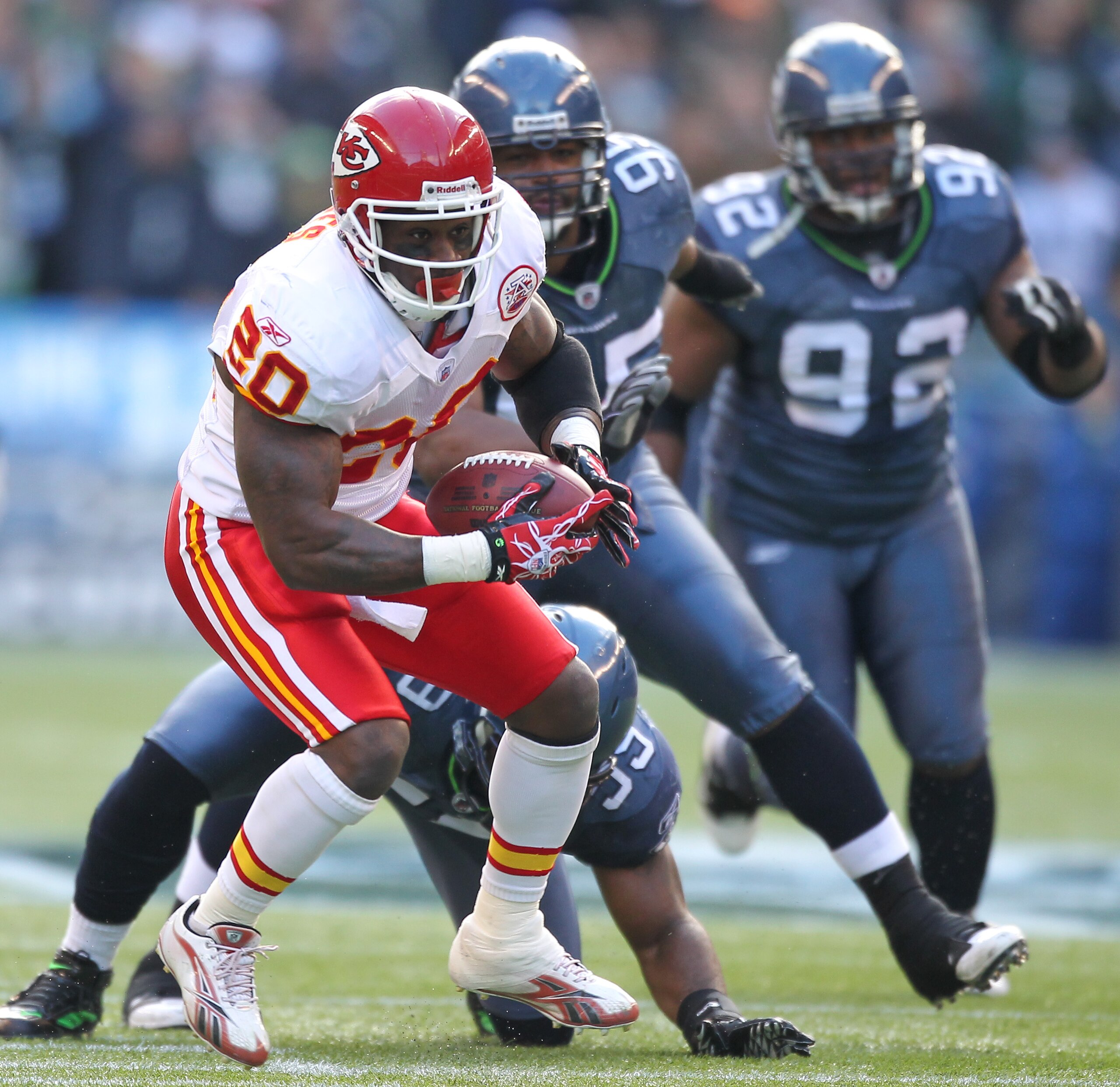 SEATTLE, WA - NOVEMBER 28:  Running back Thomas Jones #20 of the Kansas City Chiefs rushes against Aaron Curry #59 of the Seattle Seahawks at Qwest Field on November 28, 2010 in Seattle, Washington. (Photo by Otto Greule Jr/Getty Images)