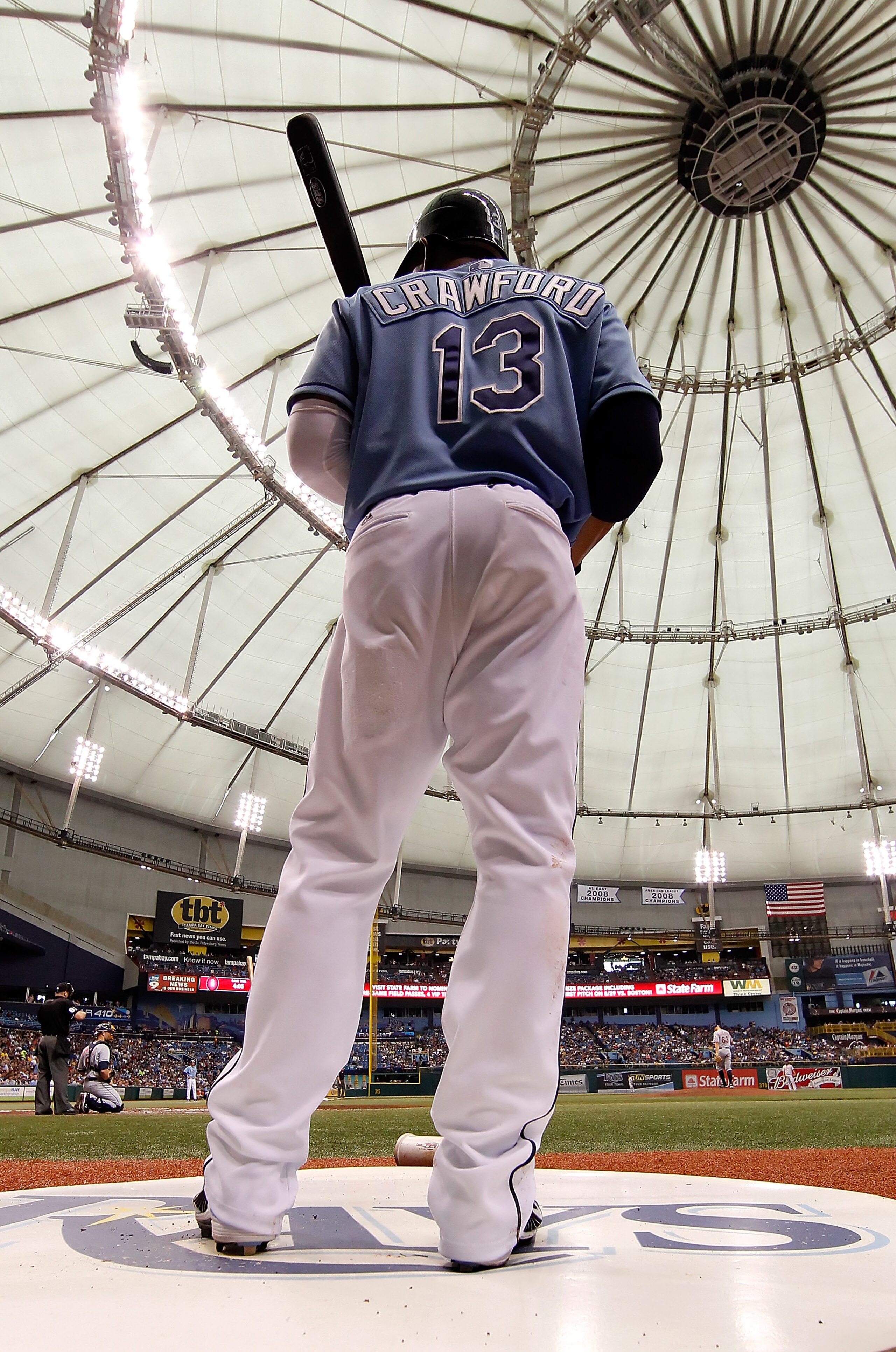 ST. PETERSBURG - JULY 11:  Designated hitter Carl Crawford #13 of the Tampa Bay Rays waits to bat against the Cleveland Indians at Tropicana Field on July 11, 2010 in St. Petersburg, Florida.  (Photo by J. Meric/Getty Images)