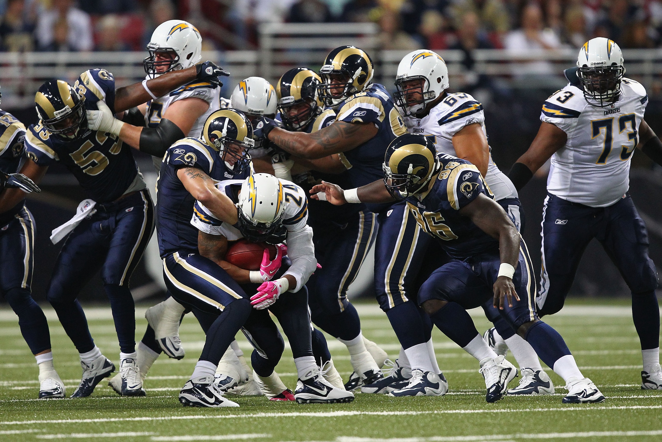 ST. LOUIS - OCTOBER 17: Ryan Mathews #24 of the San Diego Chargers is tackled by James Laurinaitis #55 of the St. Louis Rams at the Edward Jones Dome on October 17, 2010 in St. Louis, Missouri.  The Rams beat the Chargers 20-17.  (Photo by Dilip Vishwanat