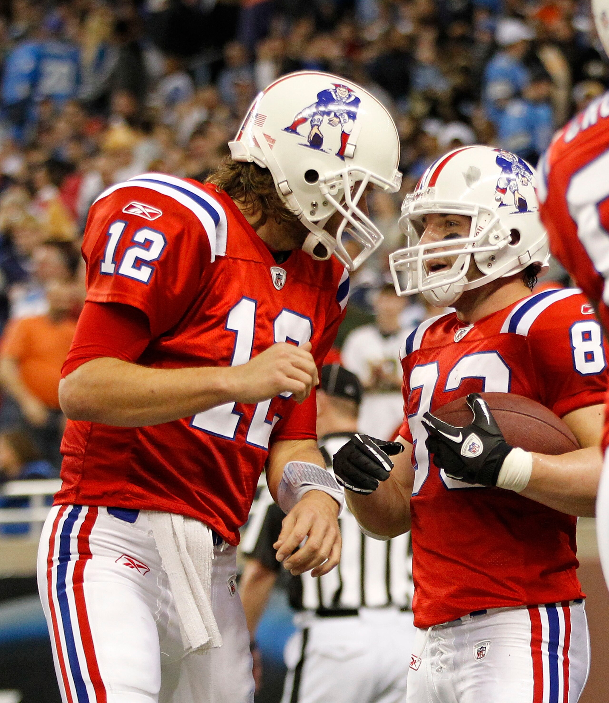 DETROIT - NOVEMBER 25:  Tom Brady #12 of the New England Patriots congratulates teammate Wes Welker #83 after a fourth quarter touchdown during the game against the Detroit Lions at Ford Field on November 25, 2010 in Detroit, Michigan. New England defeate