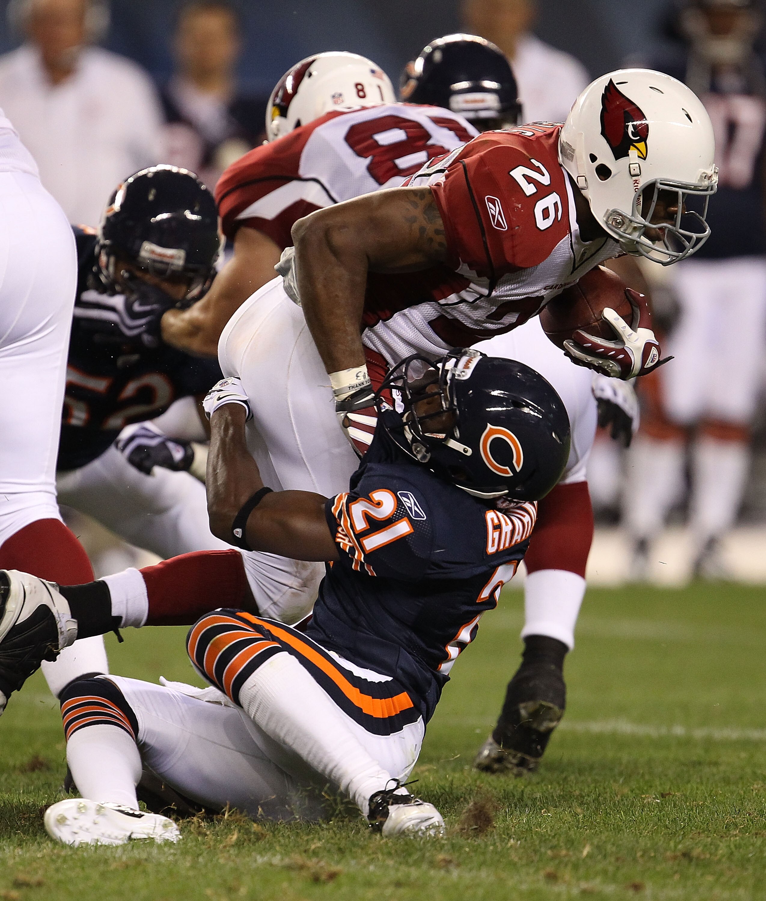 CHICAGO - AUGUST 28: Corey Graham #21 of the Chicago Bears drops Beanie Wells #26 of the Arizona Cardinals during a preseason game at Soldier Field on August 28, 2010 in Chicago, Illinois. The Cardinals defeated the Bears 14-9. (Photo by Jonathan Daniel/G