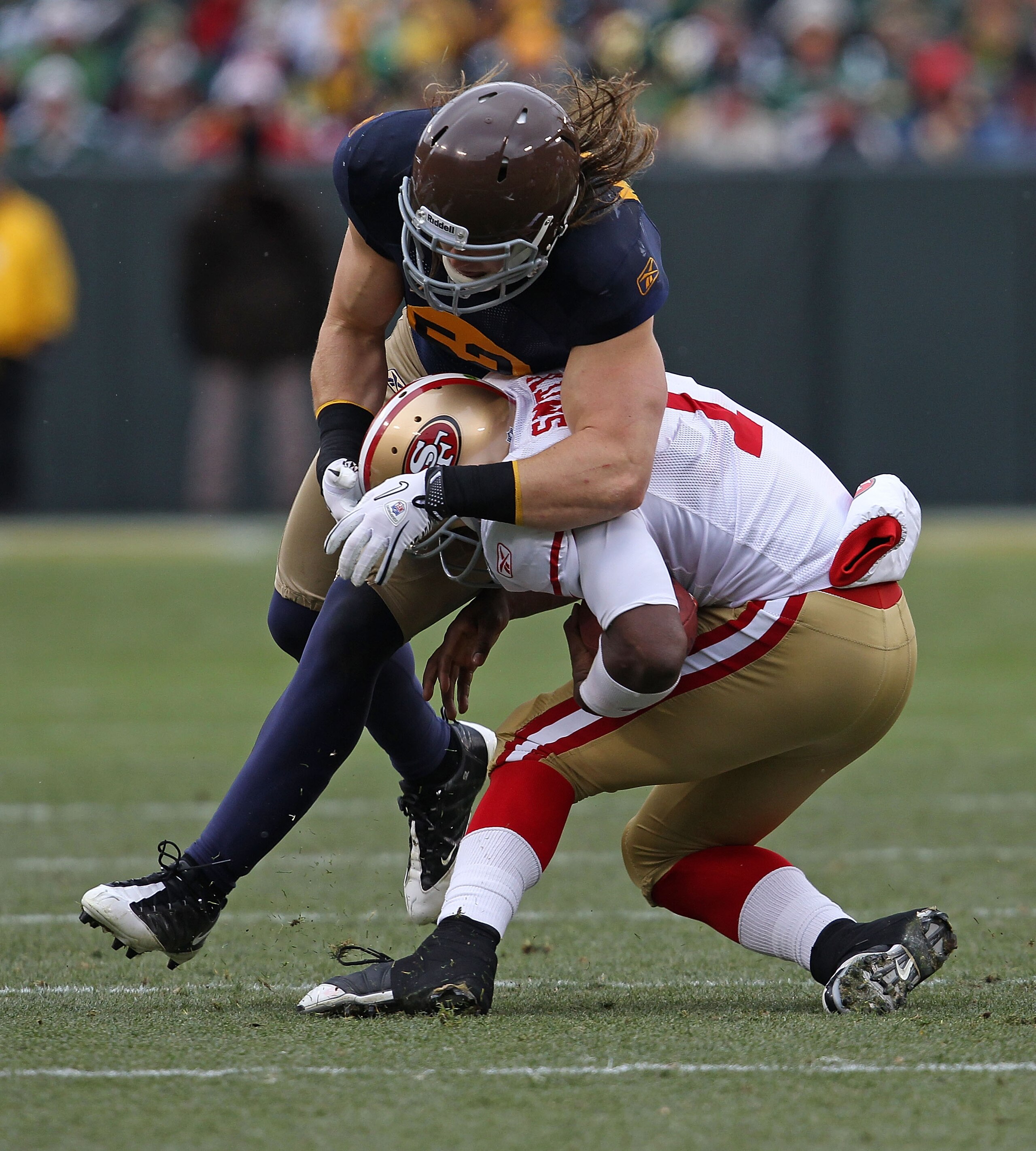 GREEN BAY, WI - DECEMBER 05: Troy Smith #1 of the San Francisco 49ers is tackled by Clay Matthews #52 of the Green Bay Packers at Lambeau Field on December 5, 2010 in Green Bay, Wisconsin. (Photo by Jonathan Daniel/Getty Images)
