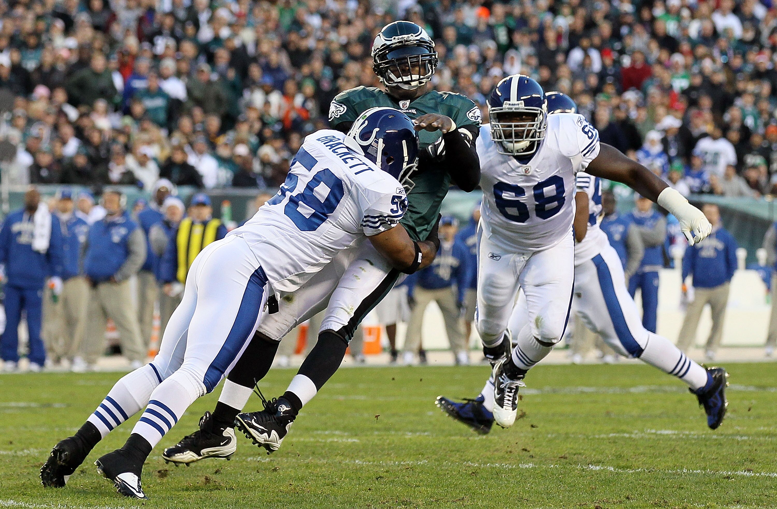 PHILADELPHIA - NOVEMBER 07:  Michael Vick #7 of the Philadelphia Eagles is hit hard by Gary Brackett #58 of the Indianapolis Colts after throwing a pass on November 7, 2010 at Lincoln Financial Field in Philadelphia, Pennsylvania.  (Photo by Jim McIsaac/G