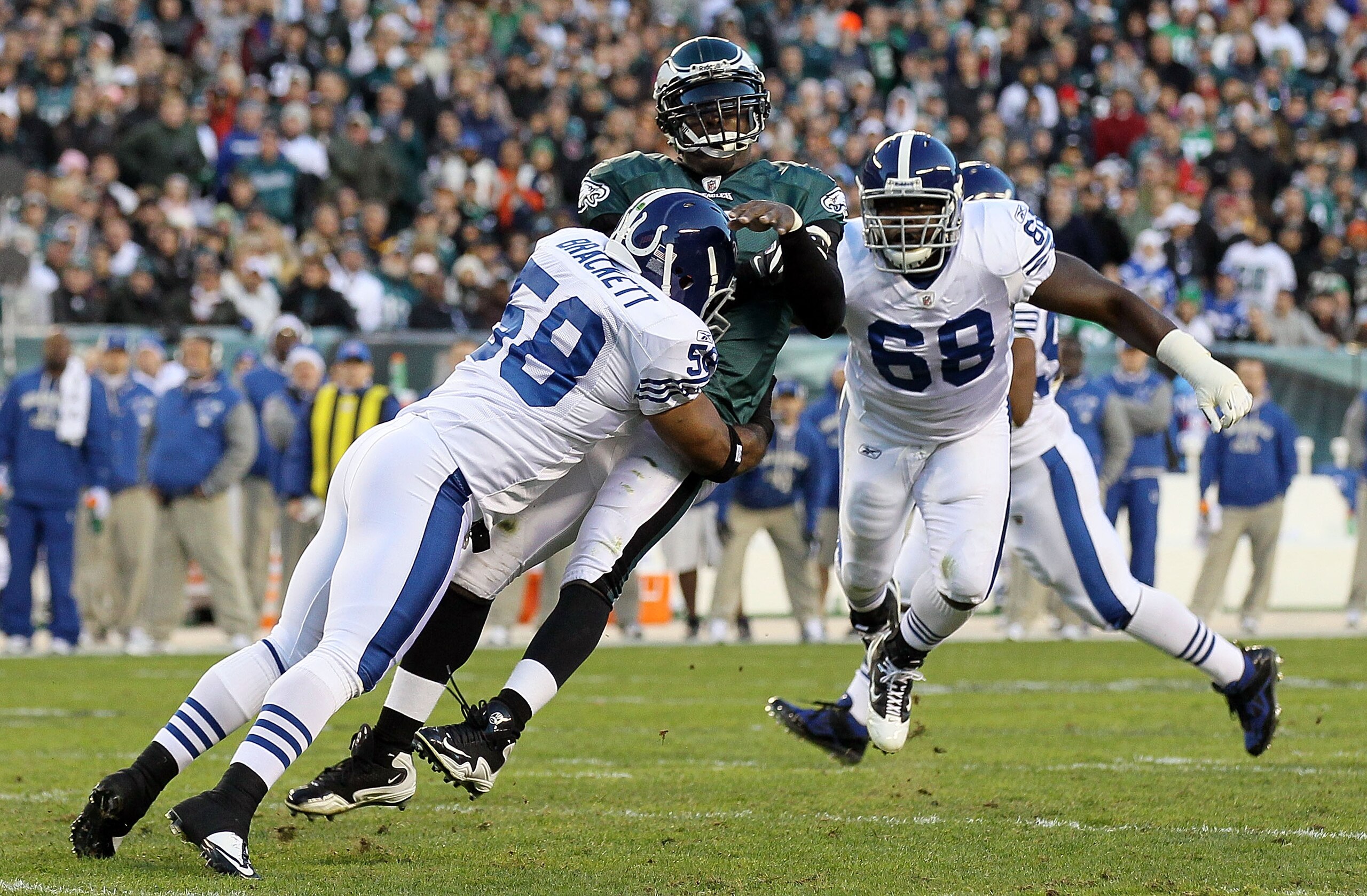 PHILADELPHIA - NOVEMBER 07:  Michael Vick #7 of the Philadelphia Eagles is hit hard by Gary Brackett #58 of the Indianapolis Colts after throwing a pass on November 7, 2010 at Lincoln Financial Field in Philadelphia, Pennsylvania.  (Photo by Jim McIsaac/G