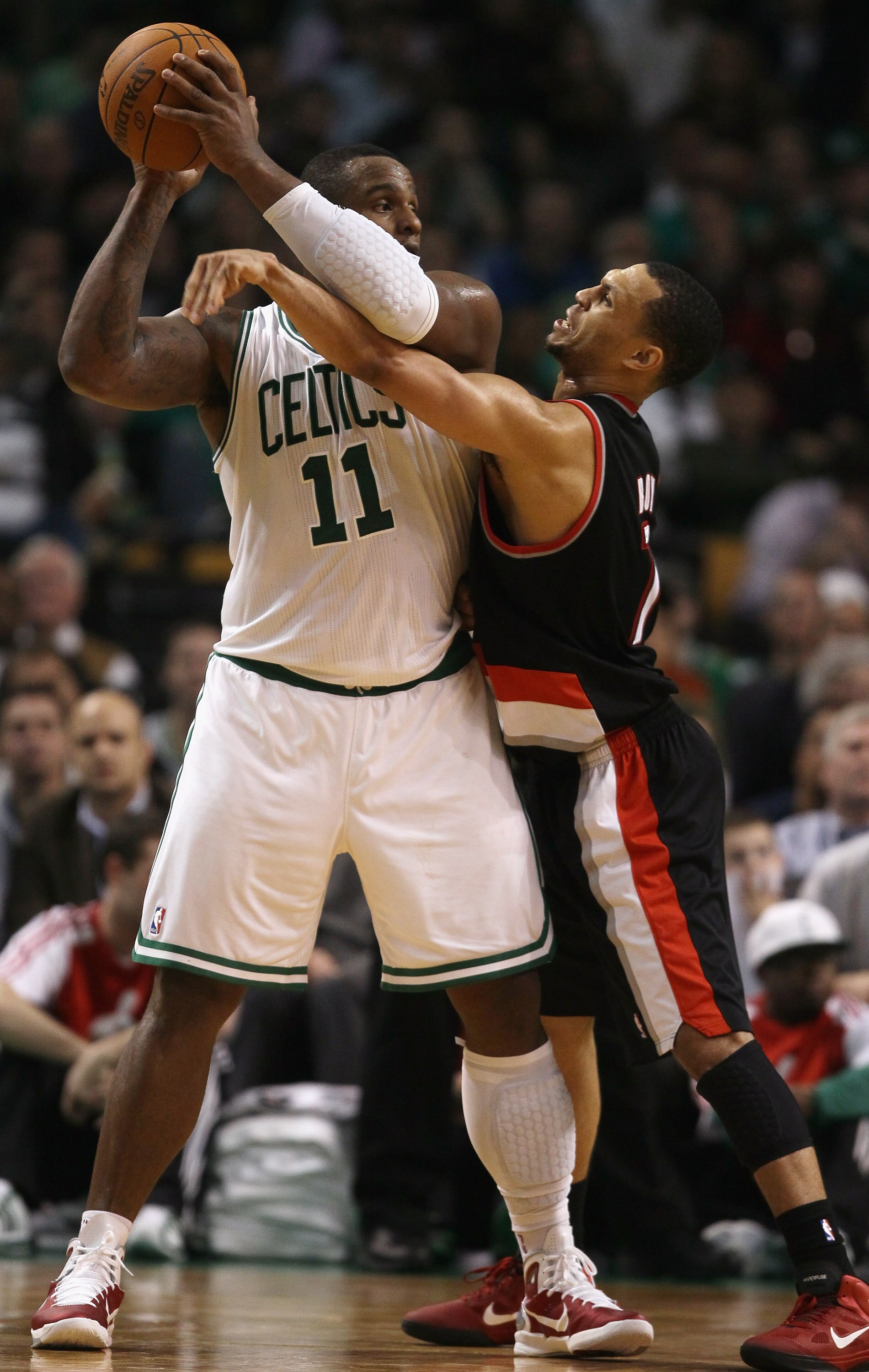 BOSTON - DECEMBER 01:  Glen Davis #11 of the Boston Celtics tries to keep the ball from Brandon Roy #7 of the Portland Trailblazers on December 1, 2010 at the TD Garden in Boston, Massachusetts. The Celtics defeated the Trailblazers 99-95. NOTE TO USER: U