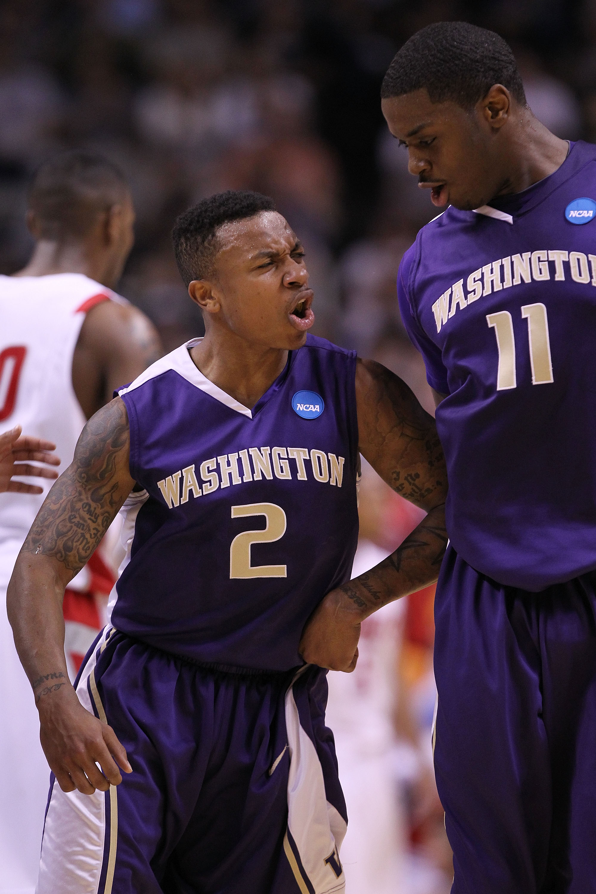 SAN JOSE, CA - MARCH 20: Guard Isaiah Thomas #2 of the Washington Huskies celebrates with Matthew Bryan-Amaning #11 after a three point basket to give the Huskies a 10 point lead against the New Mexico Lobos in the second round of the 2010 NCAA men's bas SAN JOSE, CA - MARCH 20: Guard Isaiah Thomas #2 of the Washington Huskies celebrates with Matthew Bryan-Amaning #11 after a three point basket to give the Huskies a 10 point lead against the New Mexico Lobos in the second round of the 2010 NCAA men's bas