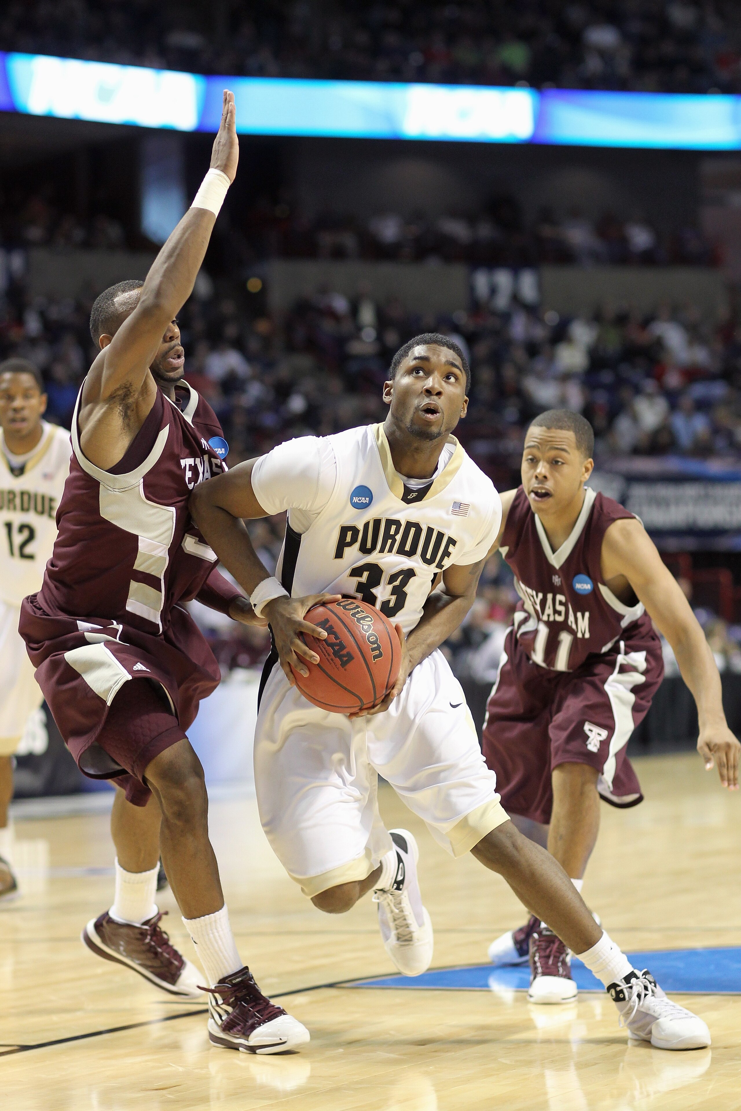 SPOKANE,WA - MARCH 21: E'Twaun Moore #33 of the Purdue Boilermakers drives the ball against the Texas A&M Aggies during the second round of the 2010 NCAA men's basketball tournament at the Spokane Arena on March 21, 2010 in Spokane, Washington. Purdue def
