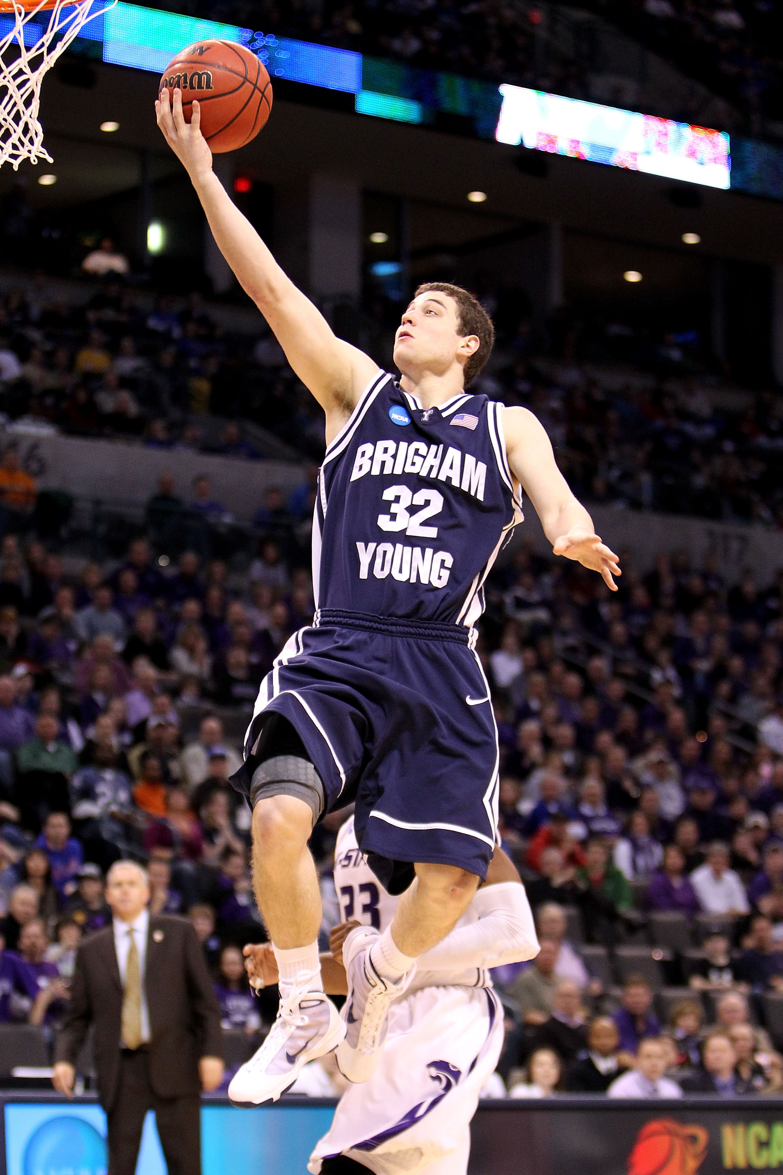 OKLAHOMA CITY - MARCH 20: Jimmer Fredette #32 of the Brigham Young Cougars drives for a shot attempt against the Kansas State Wildcats during the second round of the 2010 NCAA men's basketball tournament at Ford Center on March 20, 2010 in Oklahoma City, OKLAHOMA CITY - MARCH 20: Jimmer Fredette #32 of the Brigham Young Cougars drives for a shot attempt against the Kansas State Wildcats during the second round of the 2010 NCAA men's basketball tournament at Ford Center on March 20, 2010 in Oklahoma City,