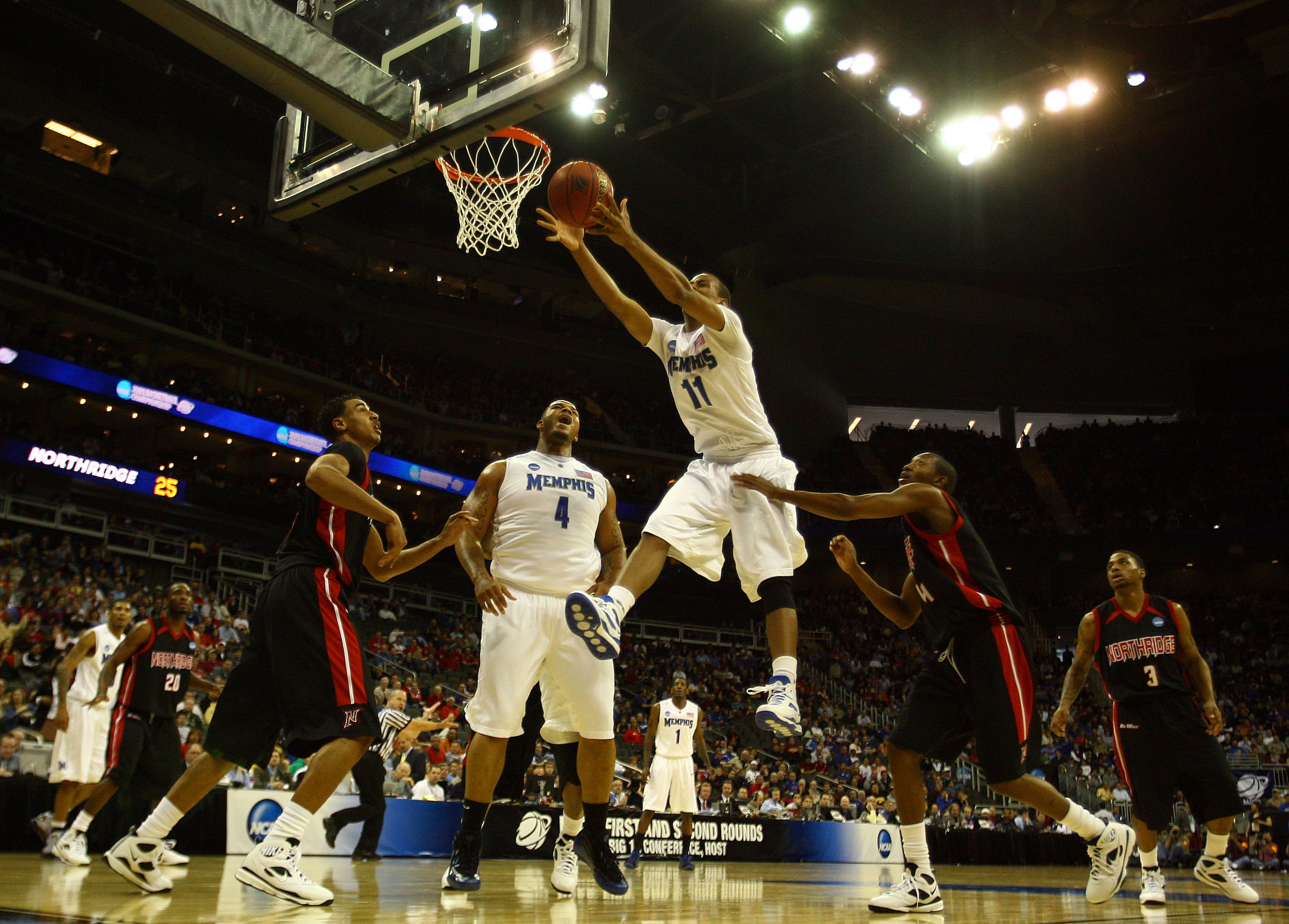 KANSAS CITY, MO - MARCH 19:  Wesley Witherspoon #11 of the Memphis Tigers goes up for the loose ball in the first half against the CSUN Matadors during the first round of the NCAA Division I Men's Basketball Tournament at the Sprint Center on March 19, 20