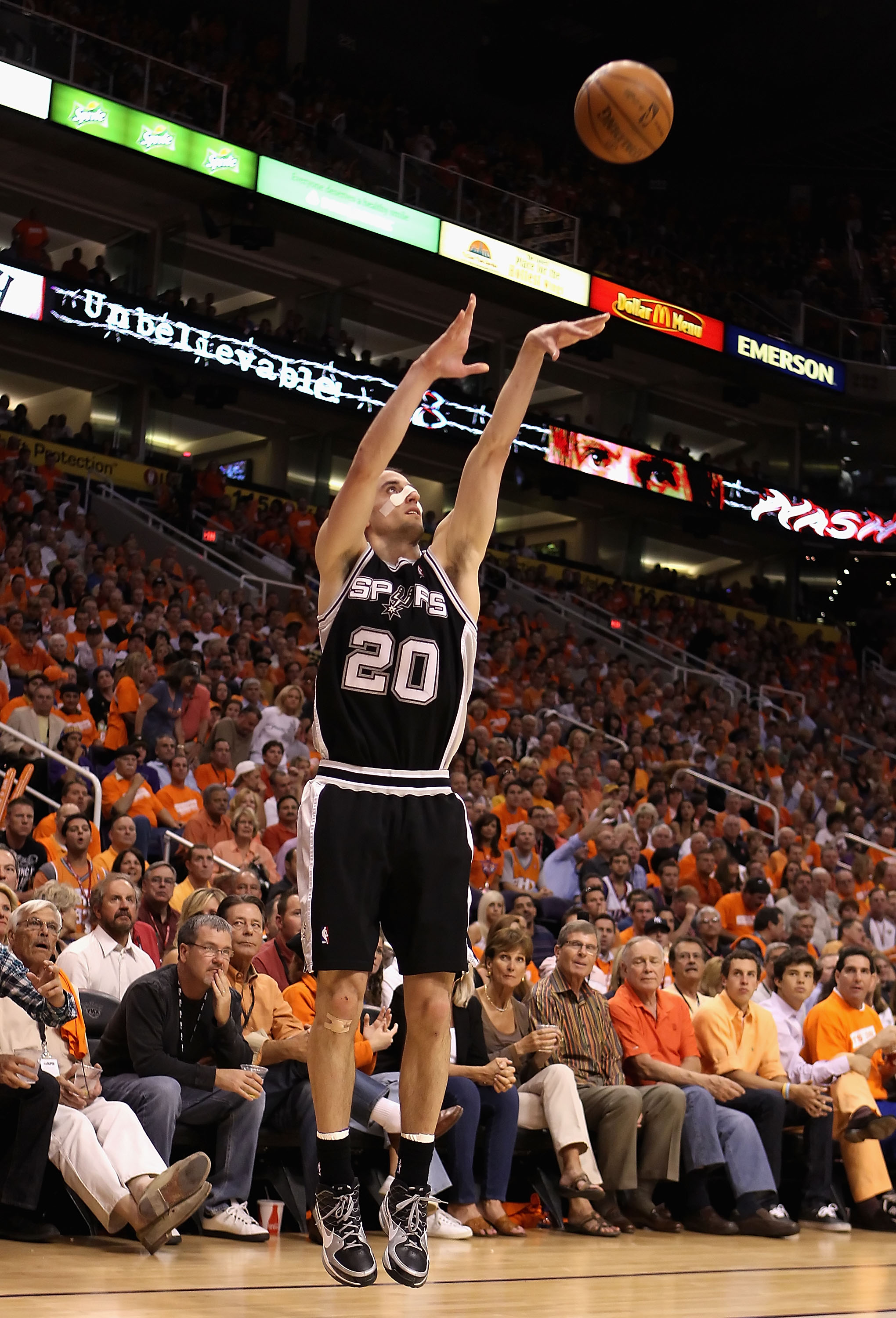 PHOENIX - MAY 03:  Manu Ginobili #20 of the San Antonio Spurs puts up a three point shot against the Phoenix Suns during Game One of the Western Conference Semifinals of the 2010 NBA Playoffs at US Airways Center on May 3, 2010 in Phoenix, Arizona. NOTE T