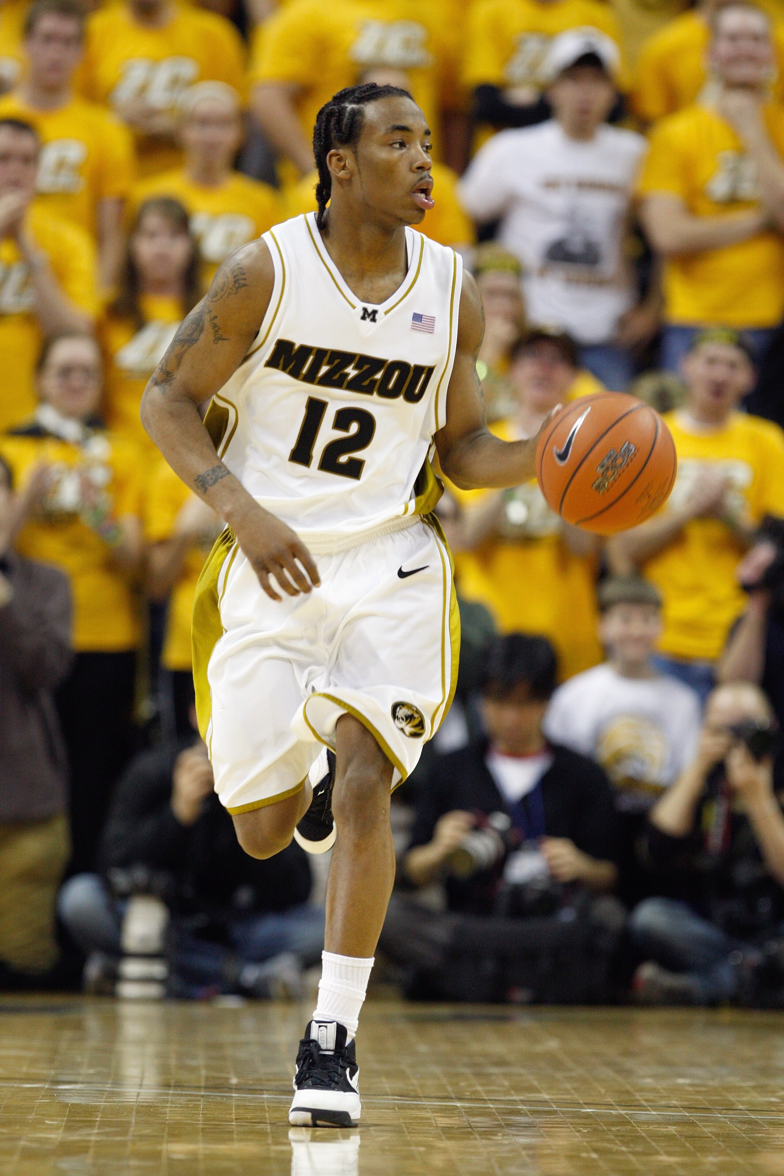 COLUMBIA, MISSOURI - FEBRUARY 9:  Marcus Denmon #12 of the Missouri Tigers dribbles the ball downcourt against the Kansas Jayhawks during the game on February 9, 2009 at Mizzou Arena in Columbia, Missouri. (Photo by: Jamie Squire/Getty Images)