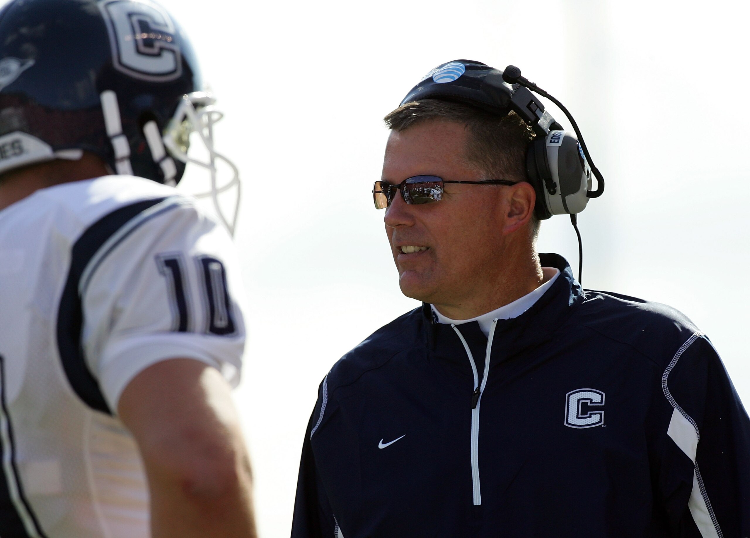 PISCATAWAY, NJ - OCTOBER 18:  Head coach Randy Edsall of the Connecticut Huskies talks with Zach Frazer #10 during a timeout against the Rutgers Scarlet Knights at Rutgers Stadium on October 18, 2008 in Piscataway, New Jersey. Rutgers defeated Connecticut