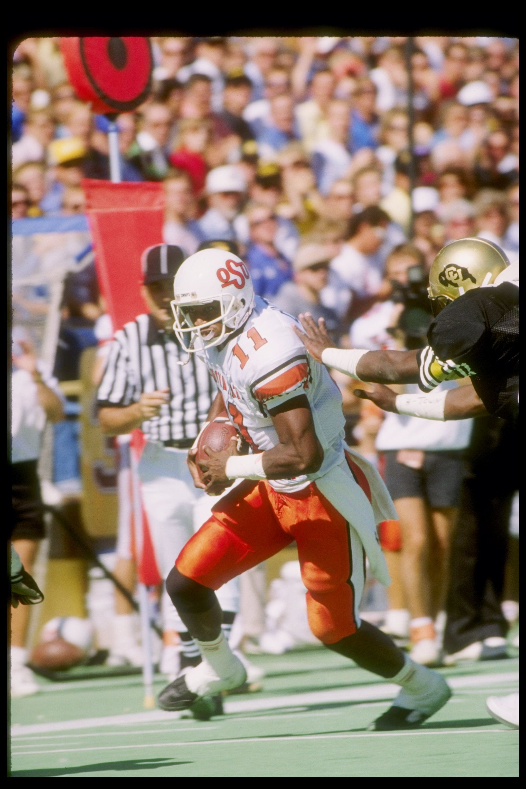 Oct 1988:  Quarterback Hart Lee Dykes of the Oklahoma State Cowboys runs to the end zone during a game versus the Colorado Buffaloes at Folsom Field in Boulder, Colorado. Mandatory Credit: Allsport  /Allsport