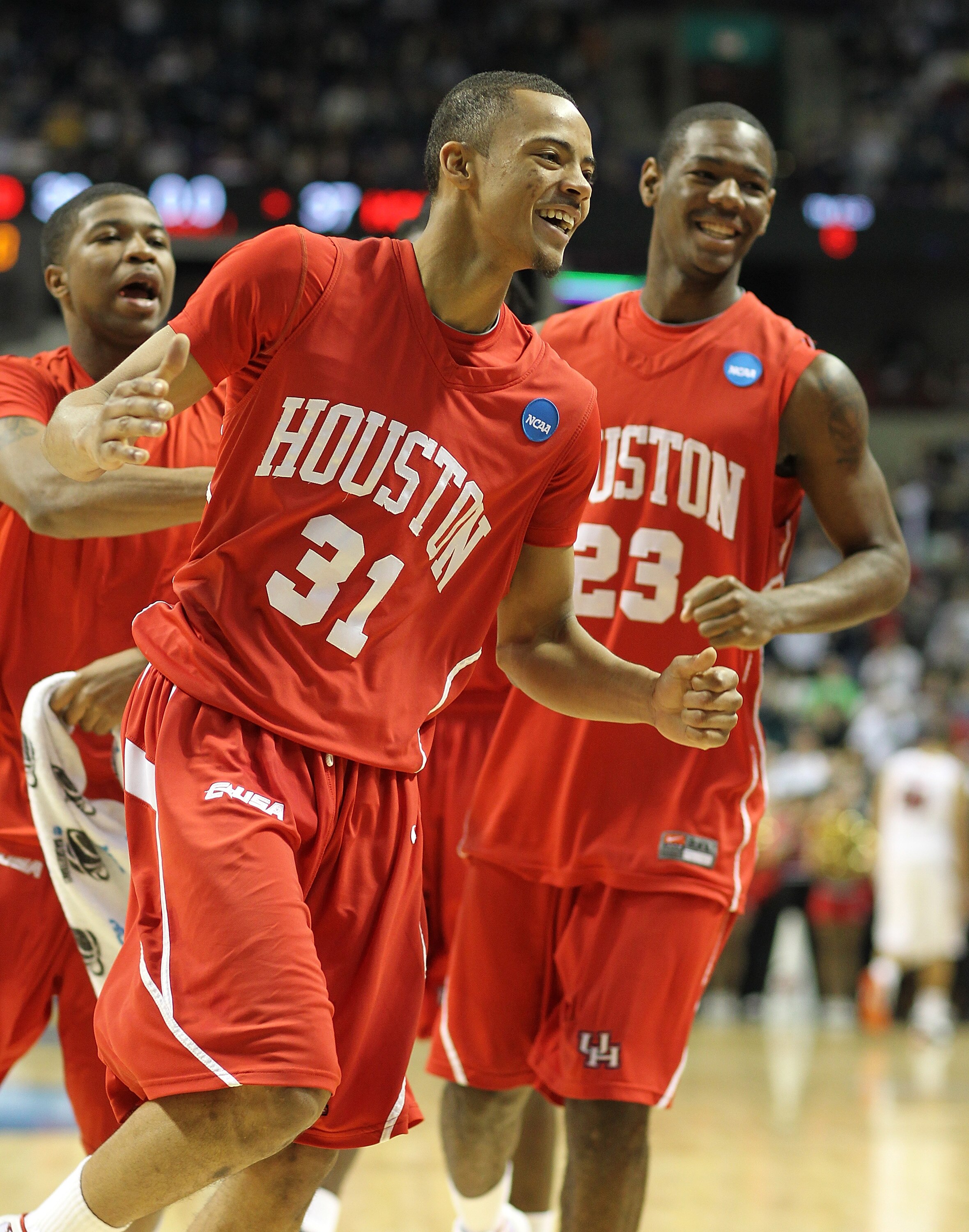 SPOKANE - MARCH 19:  Adam Brown #31 of the Houston Cougars celebrates after hitting a three-point shot with time expiring in the first half against the Maryland Terrapins in the first round of the 2010 NCAA men's basketball tournament at the Spokane Arena