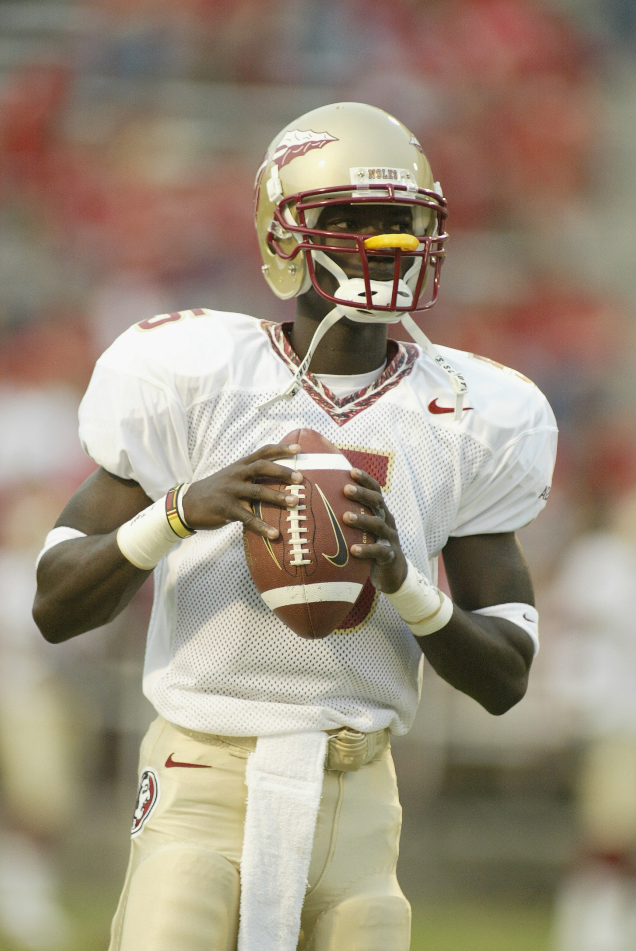 COLLEGE PARK, MARYLAND - SEPTEMBER  14:  Adrian McPherson #5 of the Florida State University Seminoles holds the ball in warmups before the game against the University of Maryland Terrapins on September 14, 2002 at Byrd Stadium in College Park, Maryland.