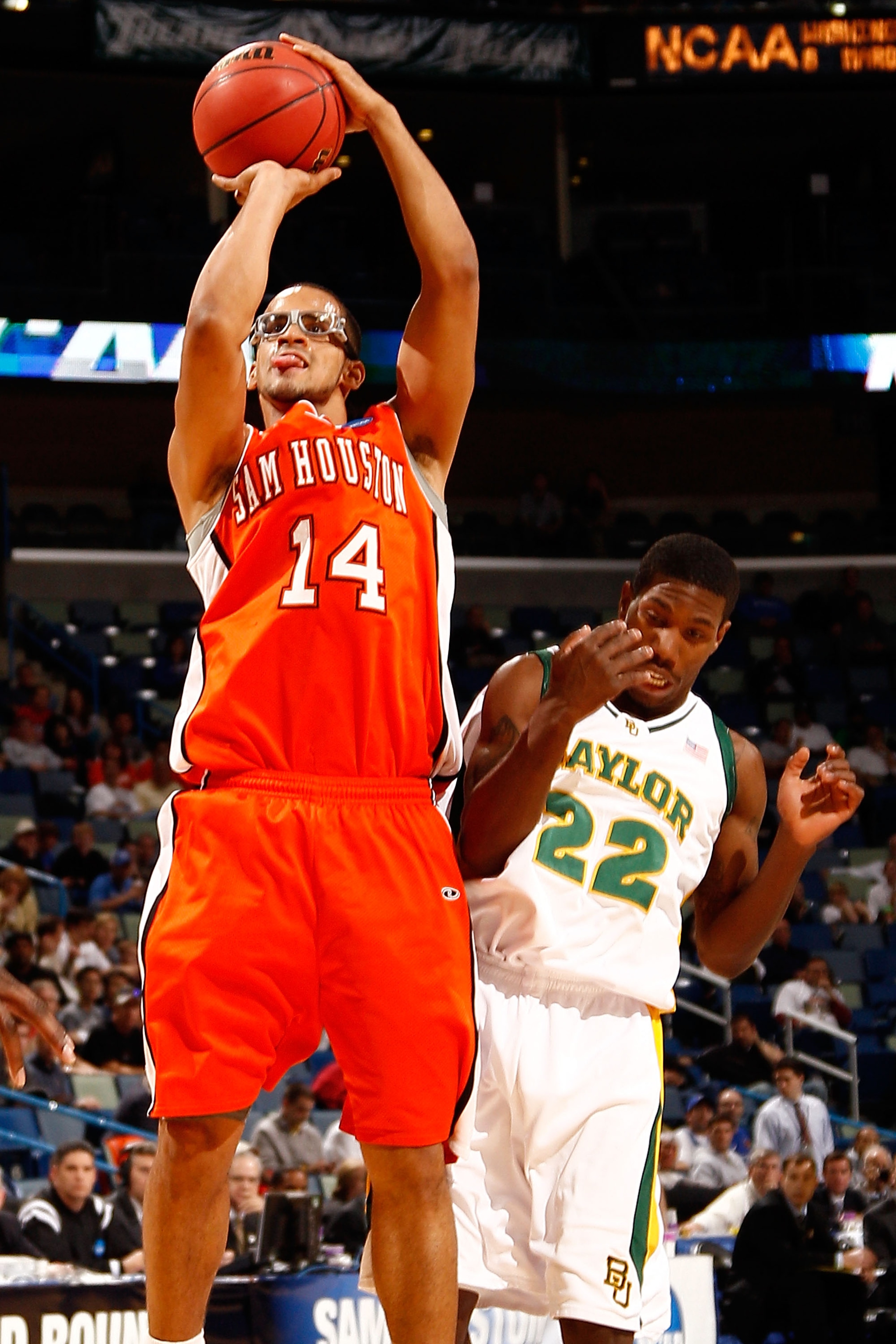 NEW ORLEANS - MARCH 18:  Gilberto Clavell #14 of the Sam Houston State Bearkats shoots as he is fouled by A.J. Walton #22 of the Baylor Bears during the first round of the 2010 NCAA men's basketball tournament at the New Orleans Arena on March 18, 2010 in