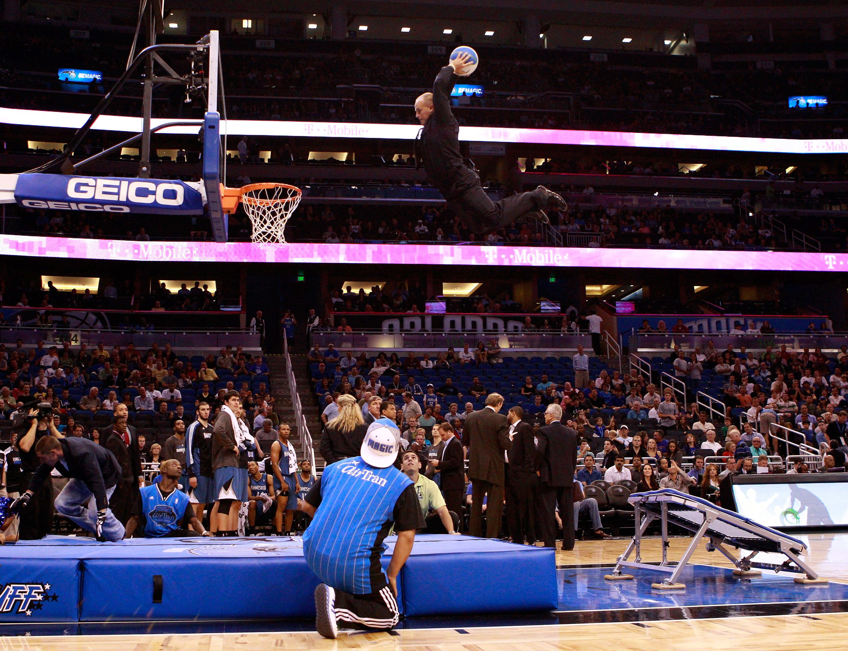 ORLANDO, FL - NOVEMBER 03:  An acrobat for the Orlando Magic performs during a timeout during the game against the Minnesota Timberwolves at Amway Arena on November 3, 2010 in Orlando, Florida.  NOTE TO USER: User expressly acknowledges and agrees that, b