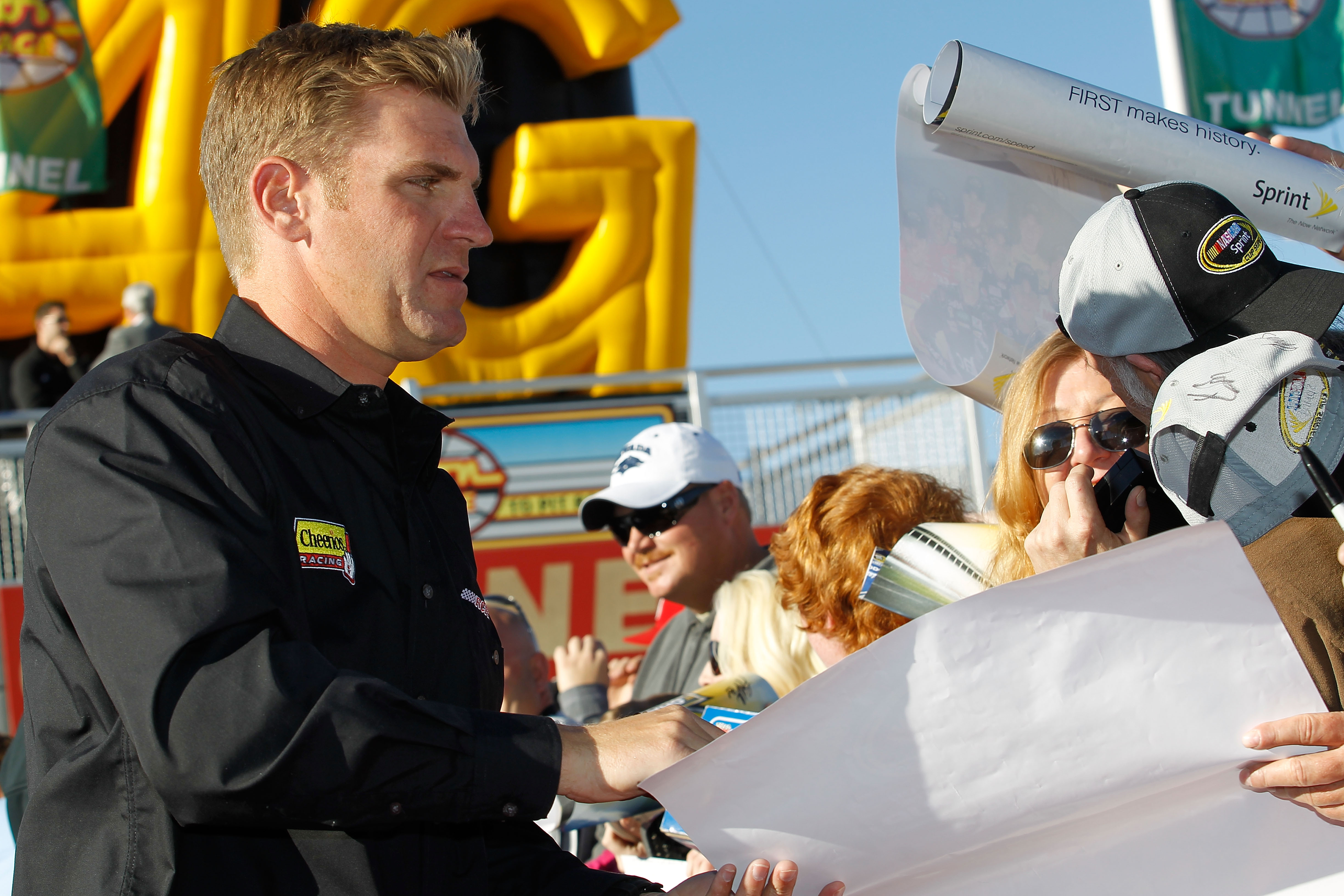 LAS VEGAS, NV - DECEMBER 01:  Clint Bowyer (L), driver of the #33 Cheerios/Hamburger Helper Chevrolet, signs autographs during Day 2 of the NASCAR Sprint Cup Series Champions Week at Las Vegas Motor Speedway on December 1, 2010 in Las Vegas, Nevada.  (Pho