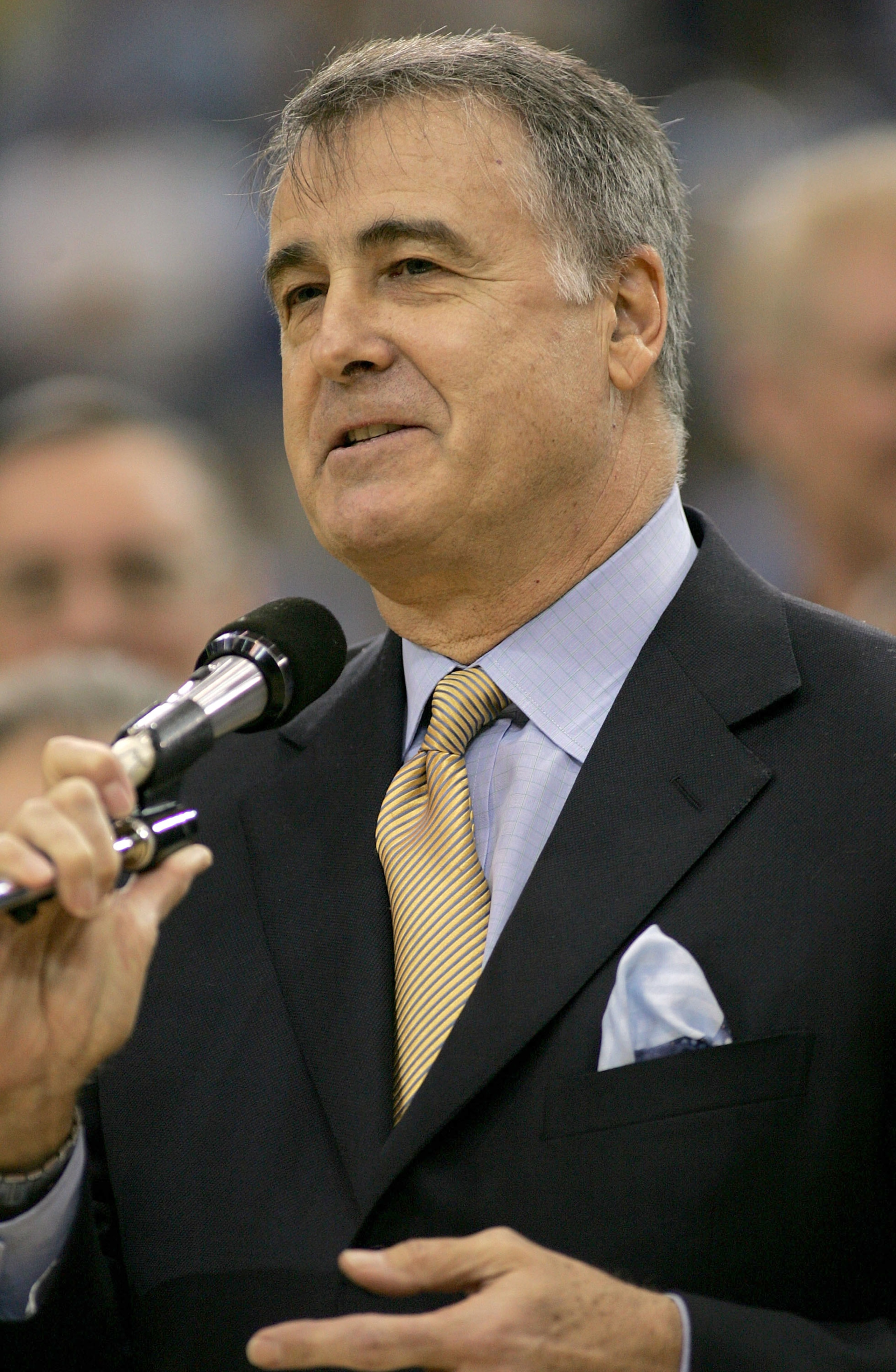 LOS ANGELES - DECEMBER 18:  Former UCLA Bruin Gail Goodrich speaks to the crowd as his number is retired during halftime of the game between the UCLA Bruins and the Michigan Wolverines on December 18, 2004 at Pauley Pavilion in Los Angeles, California.  (