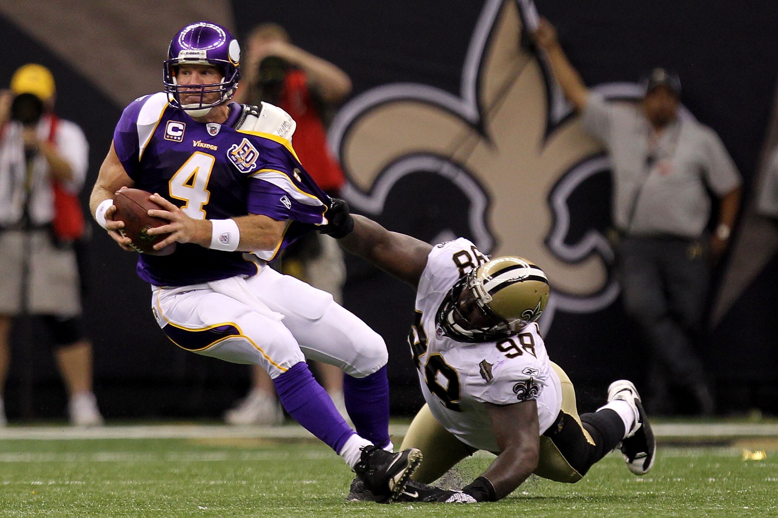 NEW ORLEANS - SEPTEMBER 09: Sedrick Ellis #98 of the New Orleans Saints pulls down Brett Favre #4 of the Minnesota Vikings at Louisiana Superdome on September 9, 2010 in New Orleans, Louisiana. The Saints won 14-9. (Photo by Ronald Martinez/Getty Images) NEW ORLEANS - SEPTEMBER 09: Sedrick Ellis #98 of the New Orleans Saints pulls down Brett Favre #4 of the Minnesota Vikings at Louisiana Superdome on September 9, 2010 in New Orleans, Louisiana. The Saints won 14-9. (Photo by Ronald Martinez/Getty Images)