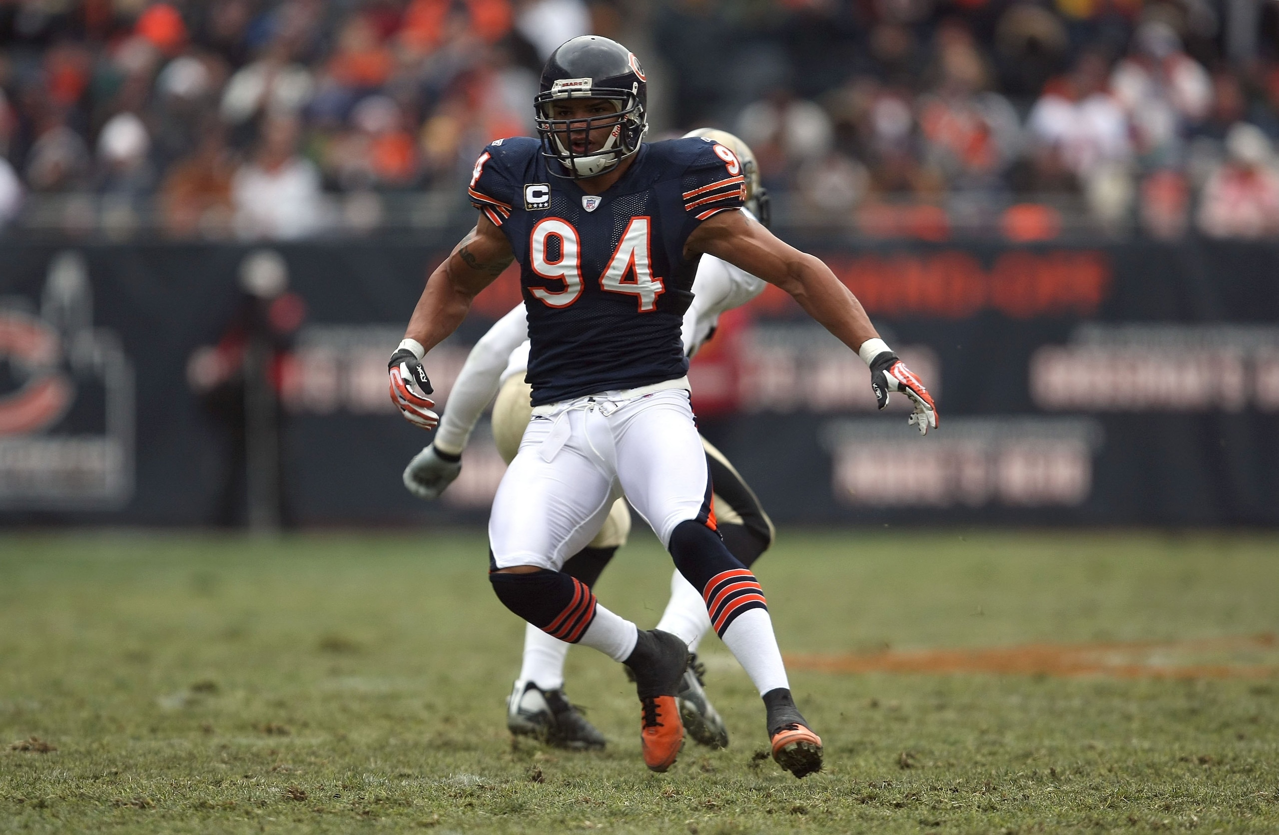CHICAGO - DECEMBER 30:  Brendon Ayanbadejo #94 of the Chicago Bears runs down field on kick coverage against the New Orleans Saints at Soldier Field on December 30, 2007 in Chicago, Illinois. The Bears won 33-25. (Photo by Jonathan Daniel/Getty Images)
