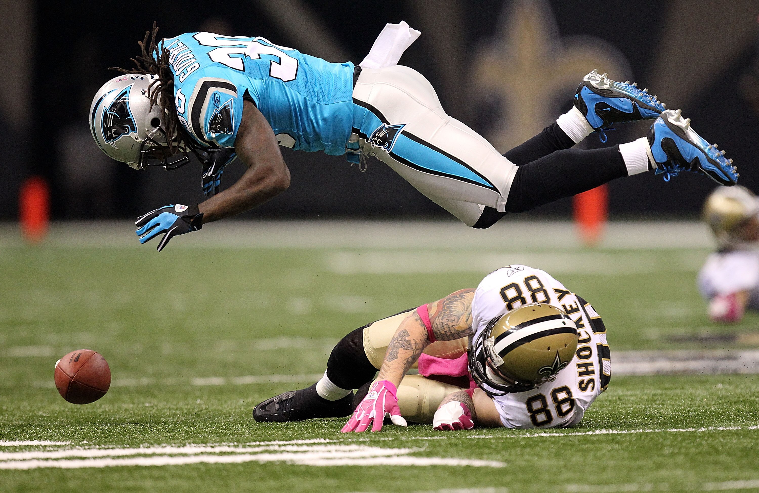 NEW ORLEANS - OCTOBER 03:  Tight end Jeremy Shockey #88 of the New Orleans Saints drops a pass against Charles Godfrey #30 of the Carolina Panthers at the Louisiana Superdome on October 3, 2010 in New Orleans, Louisiana.  (Photo by Ronald Martinez/Getty I