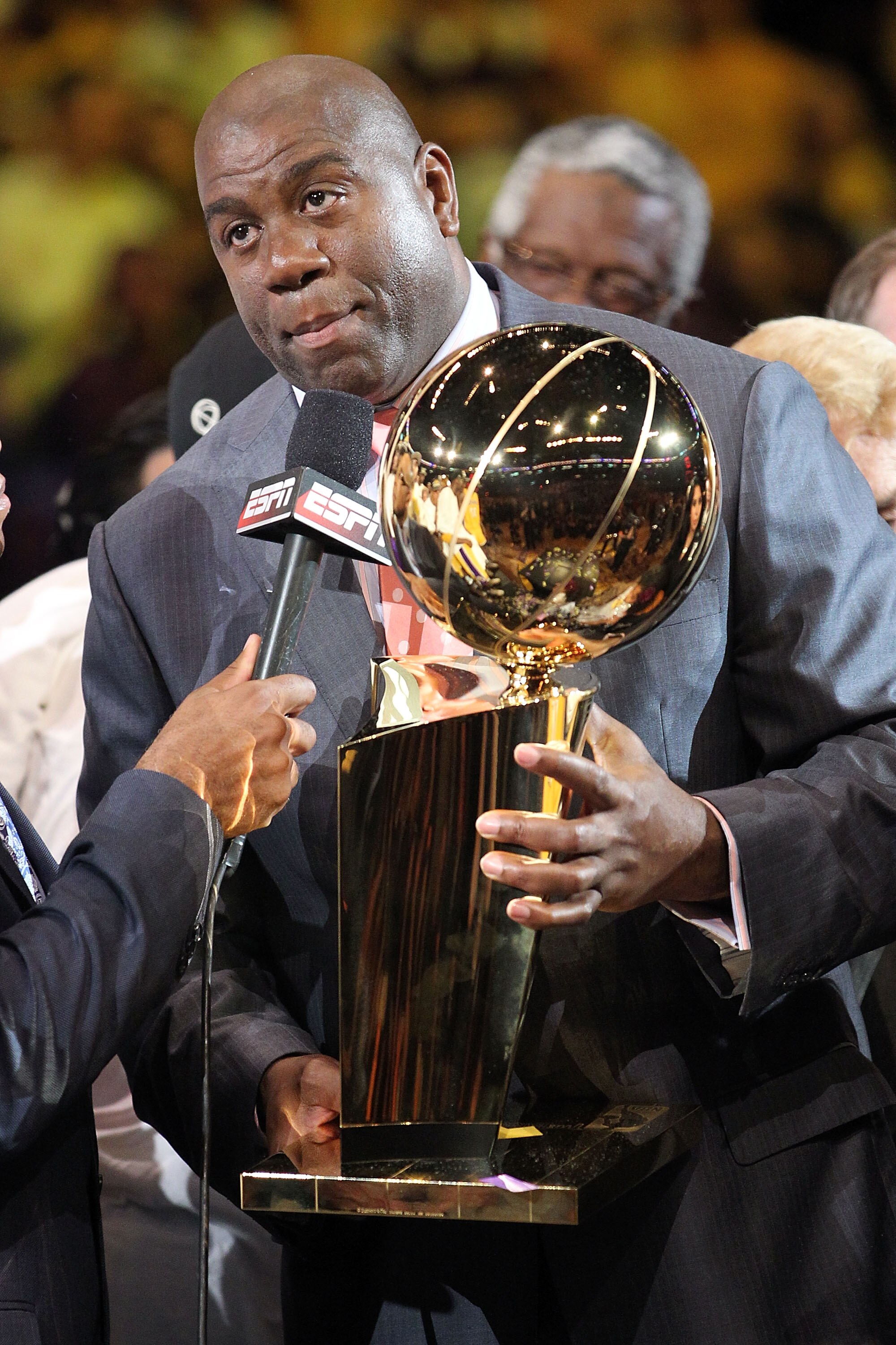 LOS ANGELES, CA - JUNE 17:  Earvin 'Magic' Johnson holds the Larry O'Brien Trophy after the Lakers defeated the Boston Celtics in Game Seven of the 2010 NBA Finals at Staples Center on June 17, 2010 in Los Angeles, California.  NOTE TO USER: User expressl