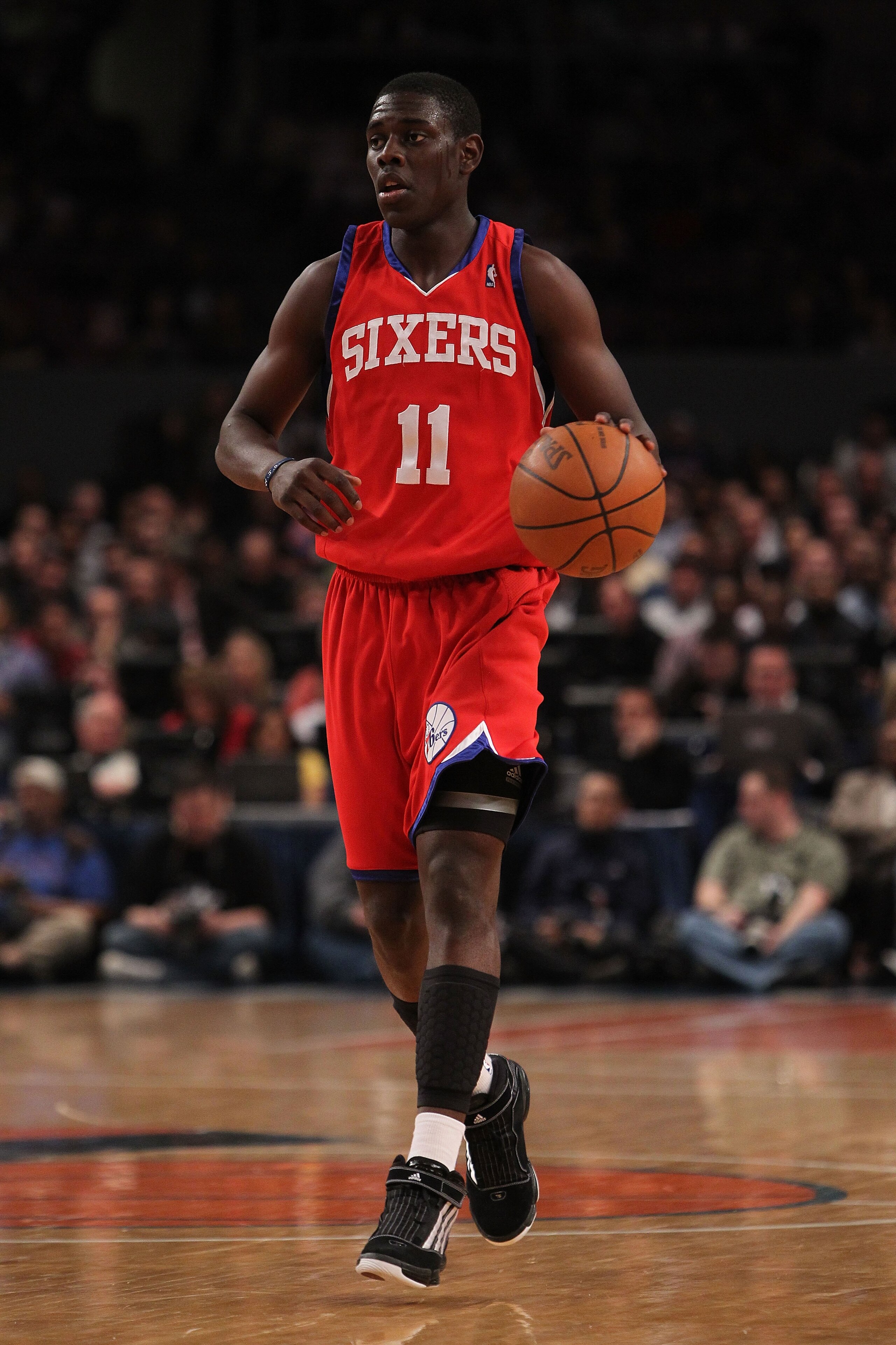 NEW YORK - MARCH 19:  Jrue Holiday #11 of the Philadelphia 76ers dribbles the ball against the New York Knicks at Madison Square Garden on March 19, 2010 in New York City. NOTE TO USER: User expressly acknowledges and agrees that, by downloading and or us