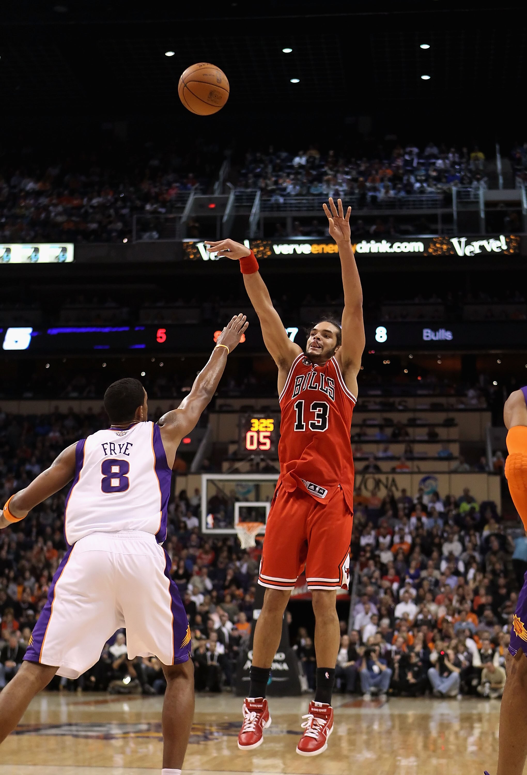 PHOENIX - NOVEMBER 24:  Joakim Noah #13 of the Chicago Bulls puts up a shot during the NBA game against the Phoenix Suns at US Airways Center on November 24, 2010 in Phoenix, Arizona. The Bulls defeated the Suns 123-115 in double overtime.  NOTE TO USER: