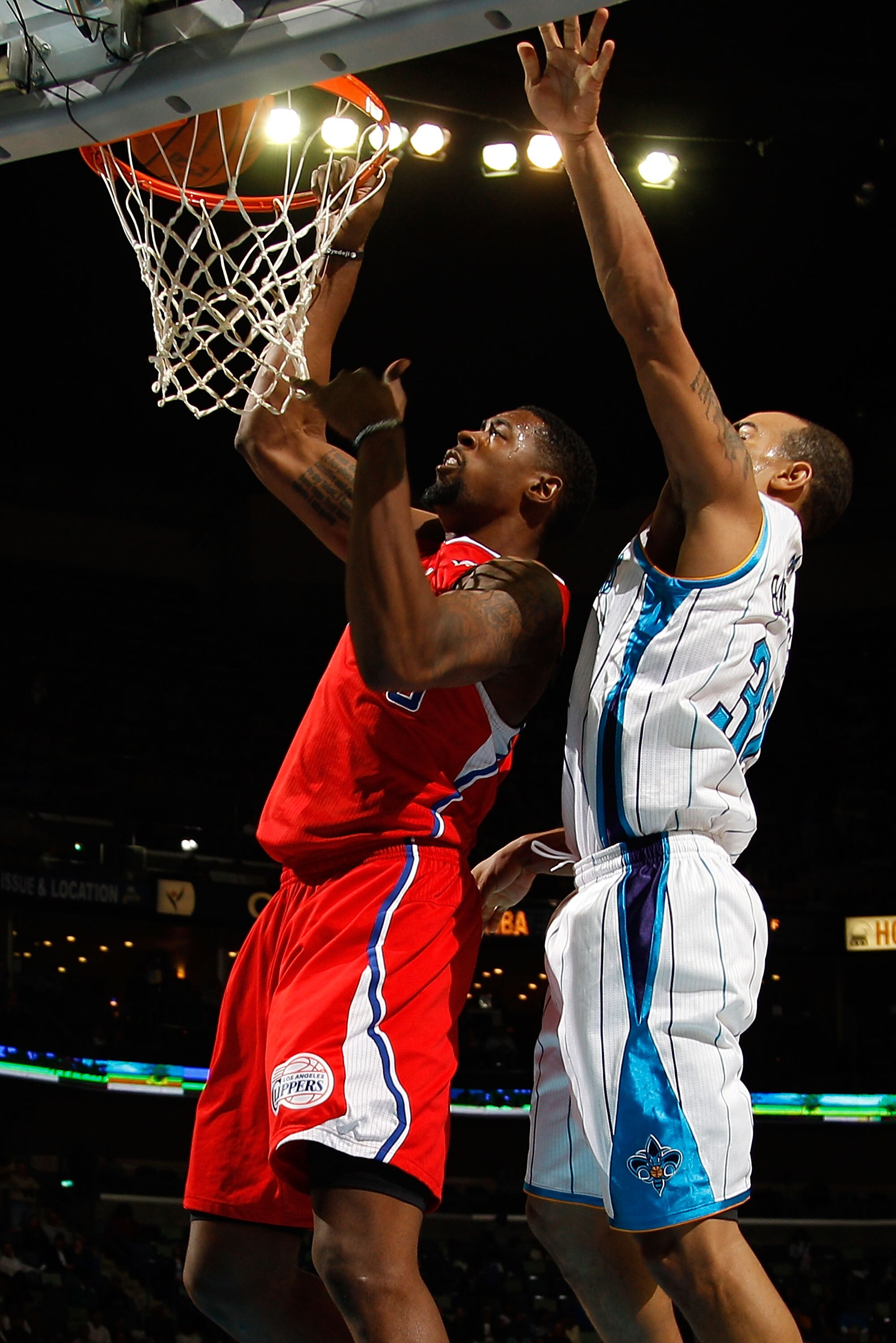 NEW ORLEANS - NOVEMBER 09:  DeAndre Jordan #9 of the Los Angeles Clippers dunks the ball over Willie Green #32 of the New Orleans Hornets at the New Orleans Arena on November 9, 2010 in New Orleans, Louisiana. The Hornets defeated the Clippers 101-82.   N