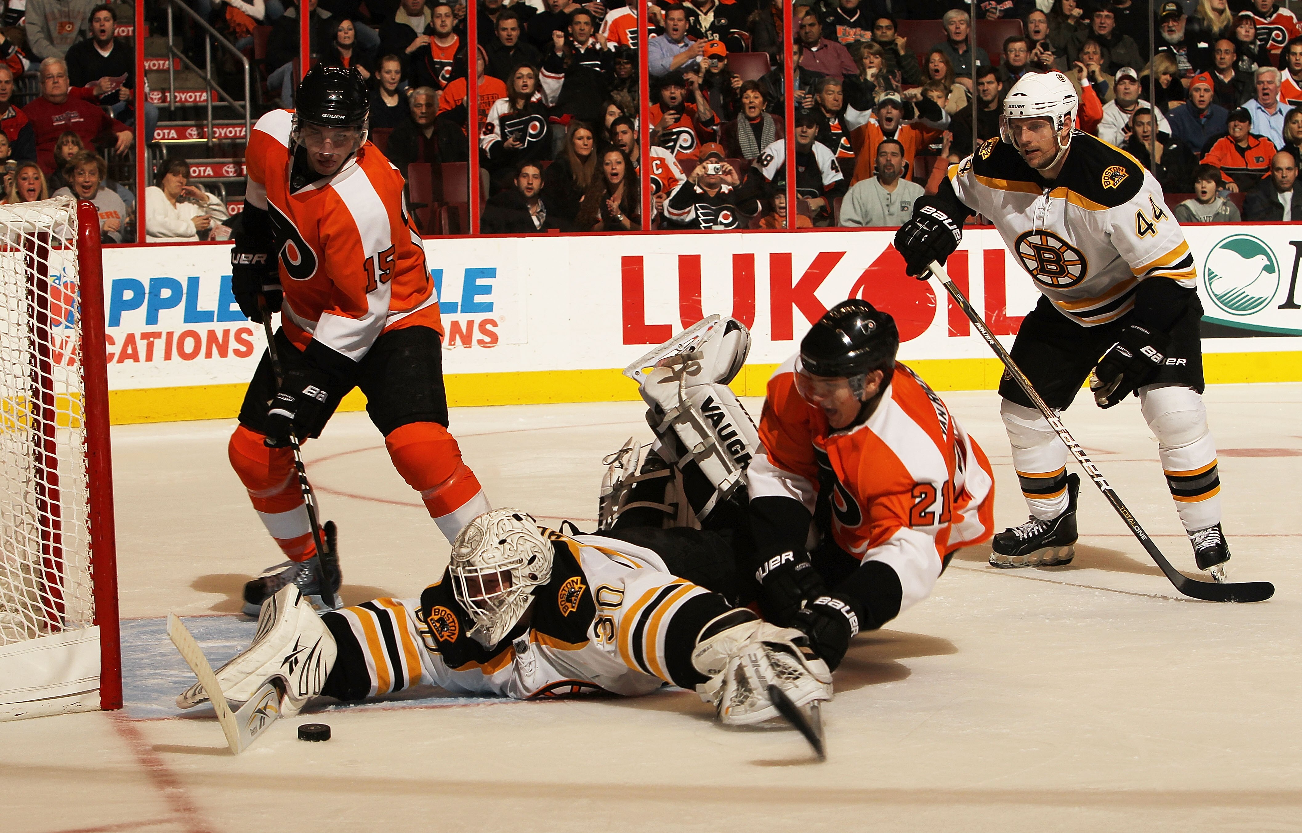 PHILADELPHIA, PA - DECEMBER 01:  Tim Thomas #30 of the Boston Bruins saves the shot of James van Riemsdyk #21 of the Philadelphia Flyers at the Wells Fargo Center on December 1, 2010 in Philadelphia, Pennsylvania.  (Photo by Nick Laham/Getty Images)