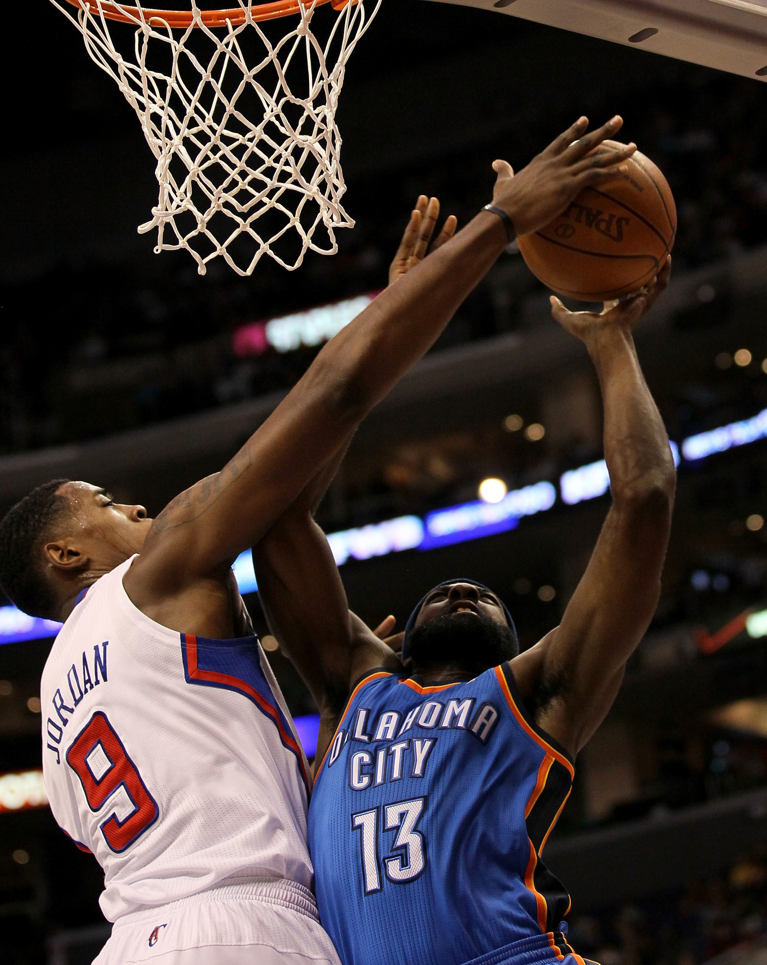 LOS ANGELES - NOVEMBER 3: DeAndre Jordan #9 of the Los Angeles Clippers blocks a shot by james harden #13 of the Oklahoma City Thunder at Staples Center on November 3, 2010 in Los Angeles, California. NOTE TO USER: User expressly acknowledges and agrees LOS ANGELES - NOVEMBER 3: DeAndre Jordan #9 of the Los Angeles Clippers blocks a shot by james harden #13 of the Oklahoma City Thunder at Staples Center on November 3, 2010 in Los Angeles, California. NOTE TO USER: User expressly acknowledges and agrees