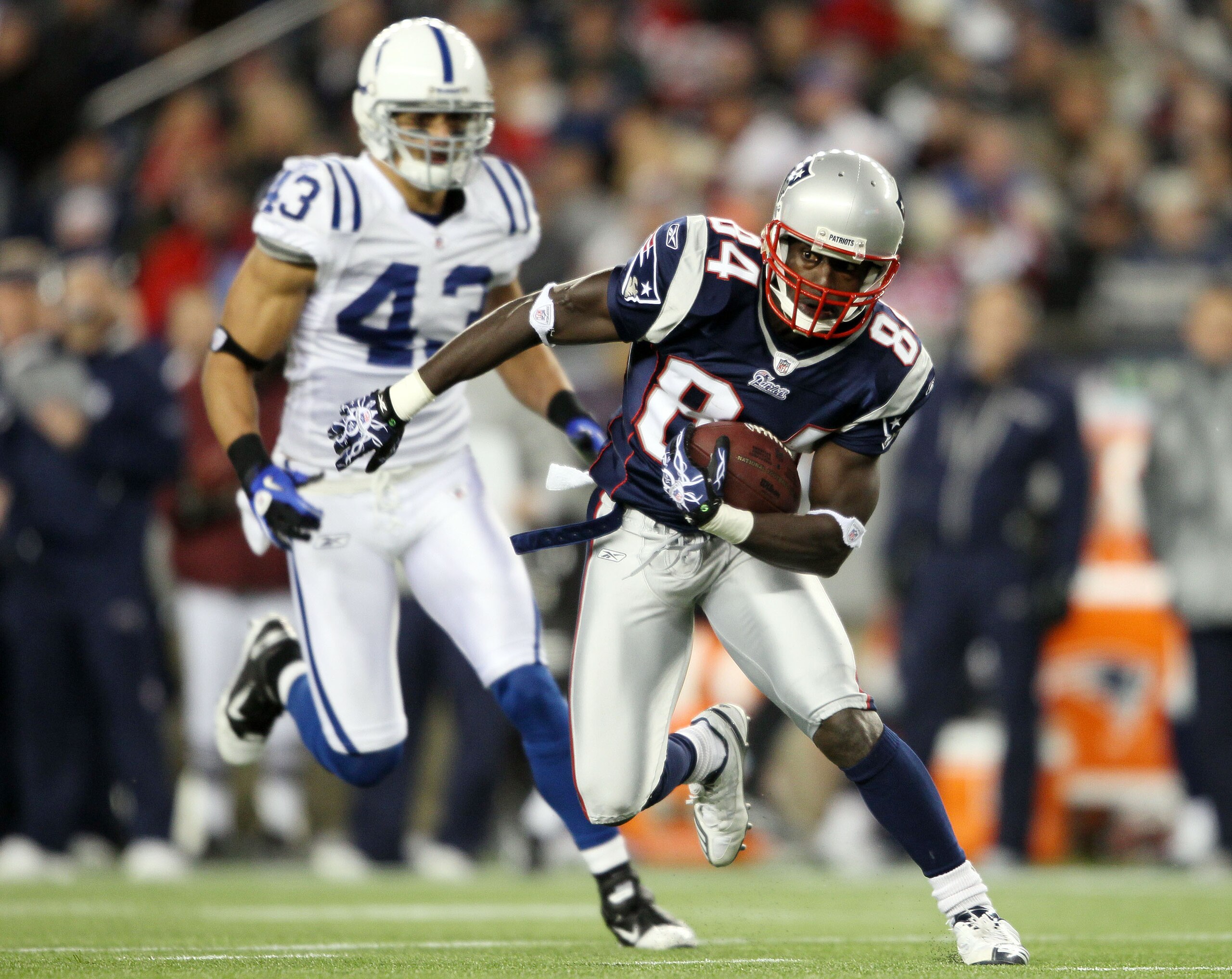 FOXBORO, MA - NOVEMBER 21: Deion Branch #84 of the New England Patriots carries the ball as Aaron Francisco #43 of the Indianapolis Colts chases on November 21, 2010 at Gillette Stadium in Foxboro, Massachusetts. The Patriots defeated the Colts 31-28. ( FOXBORO, MA - NOVEMBER 21: Deion Branch #84 of the New England Patriots carries the ball as Aaron Francisco #43 of the Indianapolis Colts chases on November 21, 2010 at Gillette Stadium in Foxboro, Massachusetts. The Patriots defeated the Colts 31-28. (