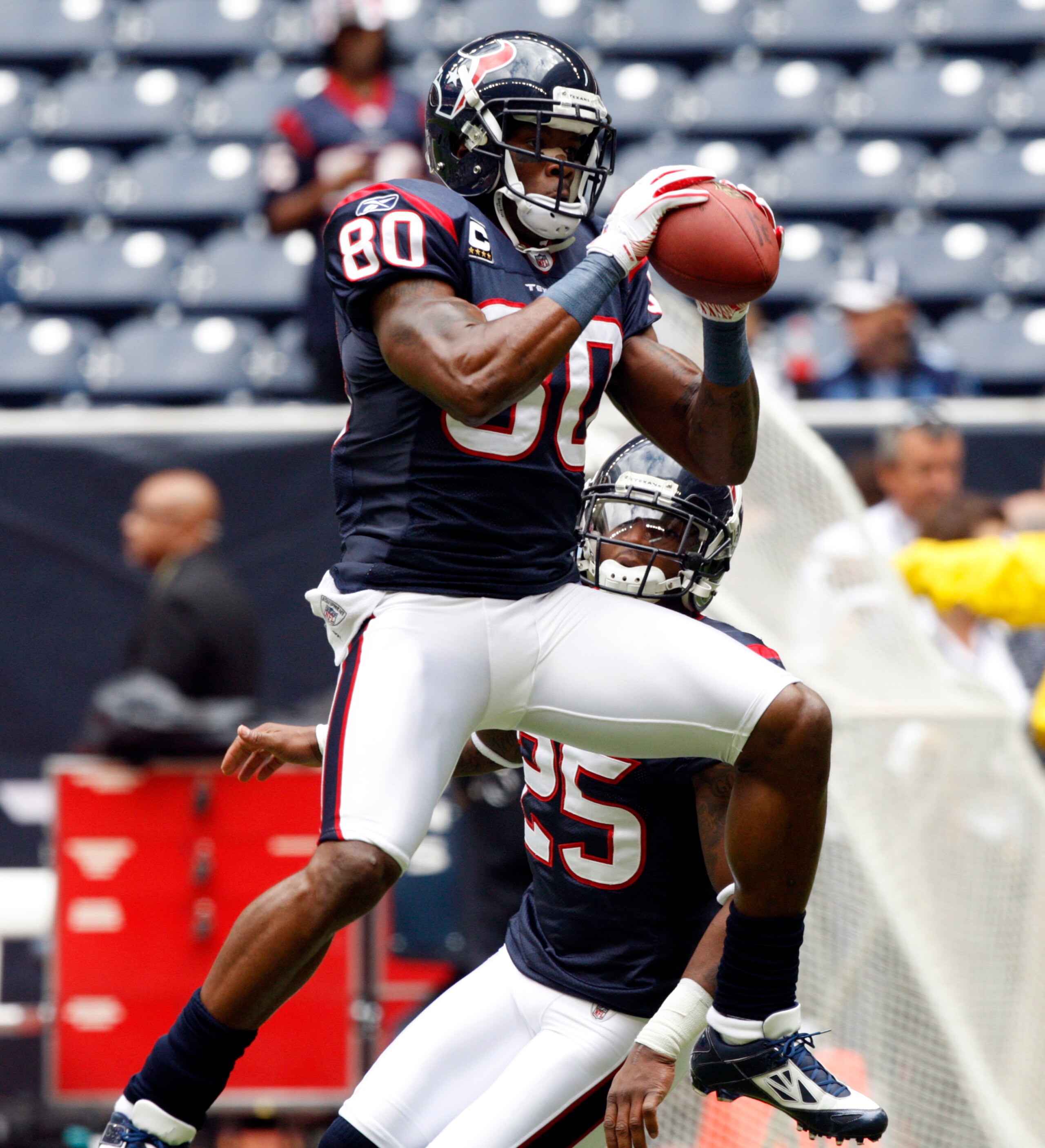 HOUSTON - NOVEMBER 28:  Wide receiver Andre Johnson #80 of the Houston Texans catches a pass during warm ups before playing the Tennessee Titans at Reliant Stadium on November 28, 2010 in Houston, Texas.  (Photo by Bob Levey/Getty Images)