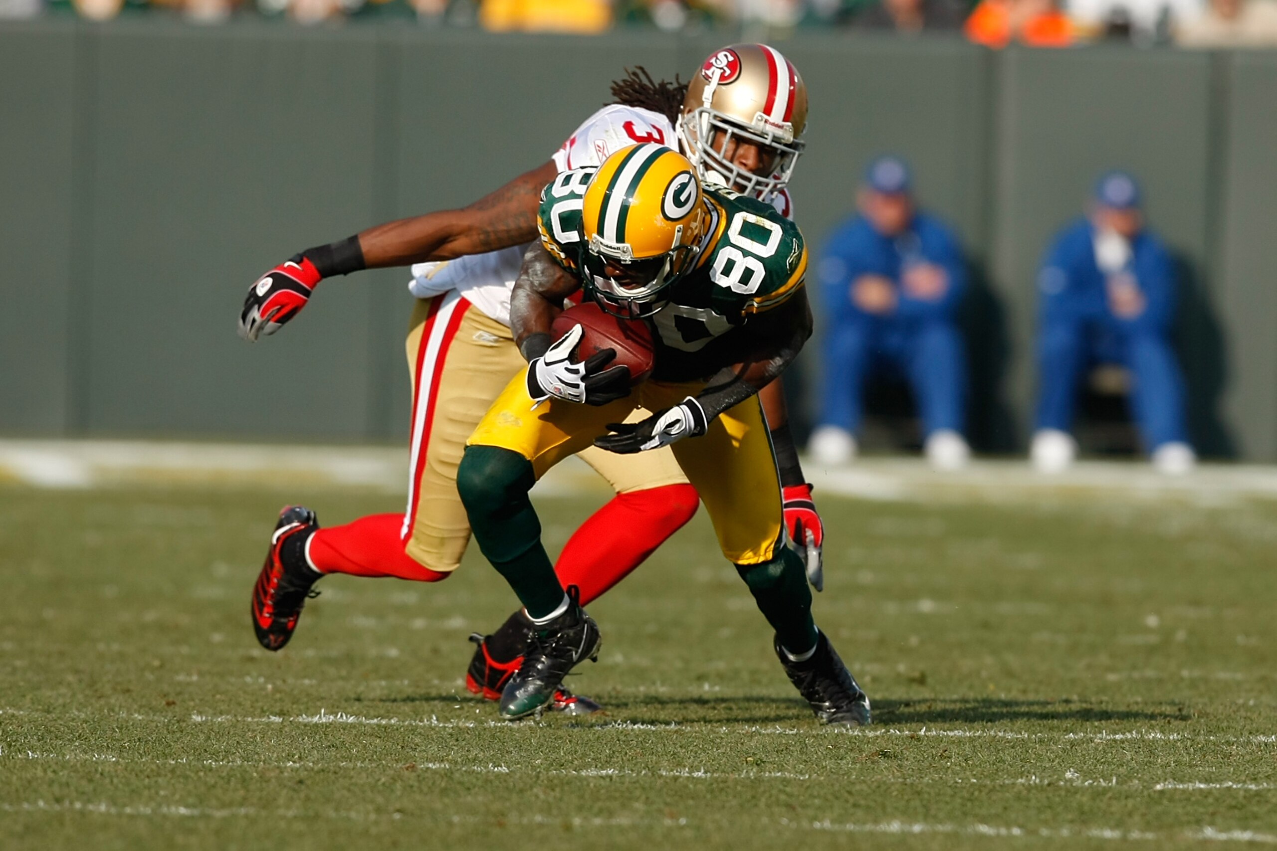 GREEN BAY, WI - NOVEMBER 22: Wide receiver Donald Driver #80 of the Green Bay Packers runs with the football after a pass reception against the San Francisco 49ers at Lambeau Field on November 22, 2009 in Green Bay, Wisconsin. The Packers defeated the 49e GREEN BAY, WI - NOVEMBER 22: Wide receiver Donald Driver #80 of the Green Bay Packers runs with the football after a pass reception against the San Francisco 49ers at Lambeau Field on November 22, 2009 in Green Bay, Wisconsin. The Packers defeated the 49e