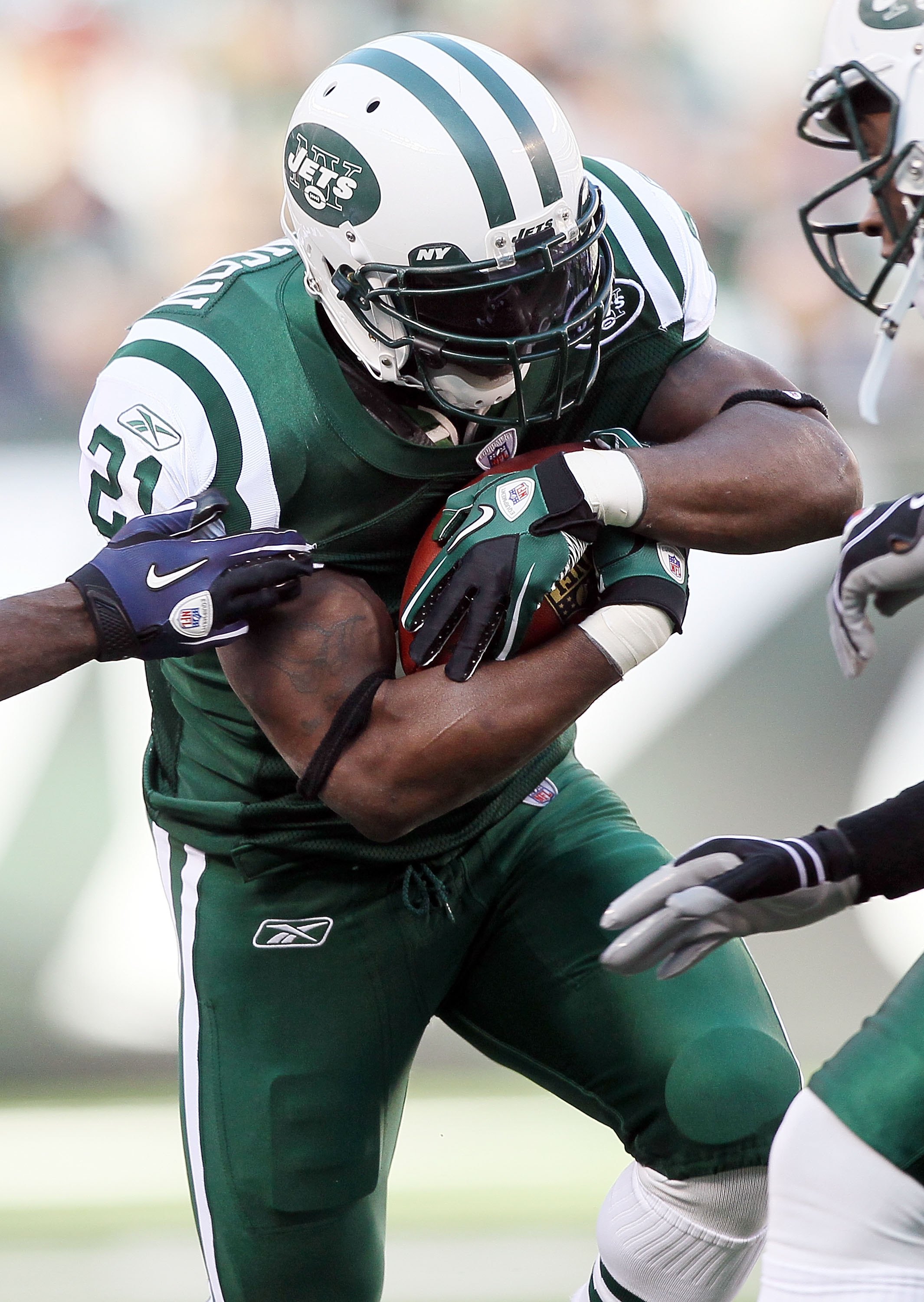 EAST RUTHERFORD, NJ - NOVEMBER 21:  LaDainian Tomlinson #21 of the New York Jets runs against the Houston Texans on November 21, 2010 at the New Meadowlands Stadium in East Rutherford, New Jersey.  (Photo by Jim McIsaac/Getty Images)