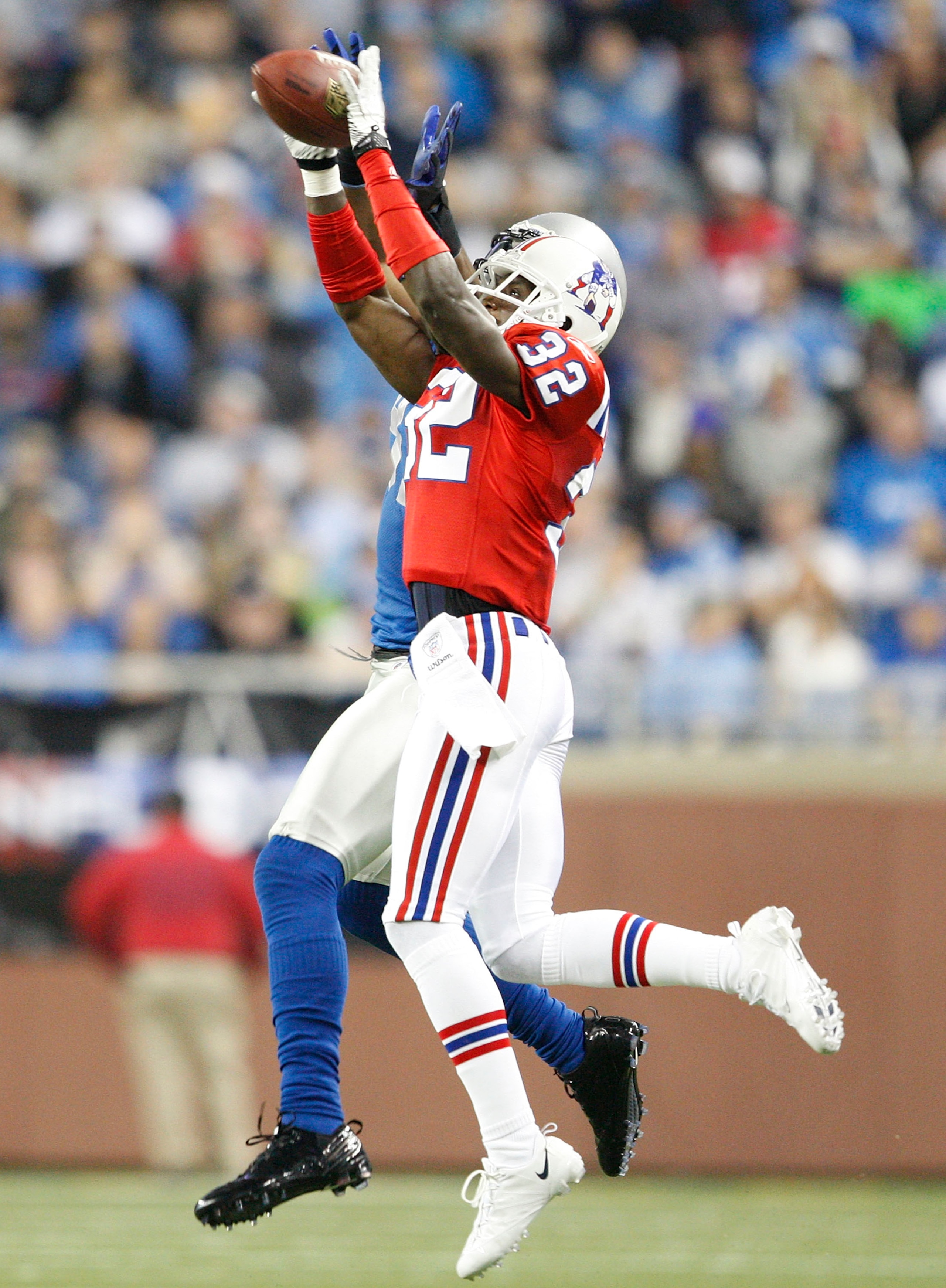 DETROIT - NOVEMBER 25: Devin McCourty #32 of the New England Patriots intercepts the ball during the fourth quarter of the game against the Detroit Lions at Ford Field on November 25, 2010 in Detroit, Michigan. New England defeated Detroit 45-24. (Photo DETROIT - NOVEMBER 25: Devin McCourty #32 of the New England Patriots intercepts the ball during the fourth quarter of the game against the Detroit Lions at Ford Field on November 25, 2010 in Detroit, Michigan. New England defeated Detroit 45-24. (Photo