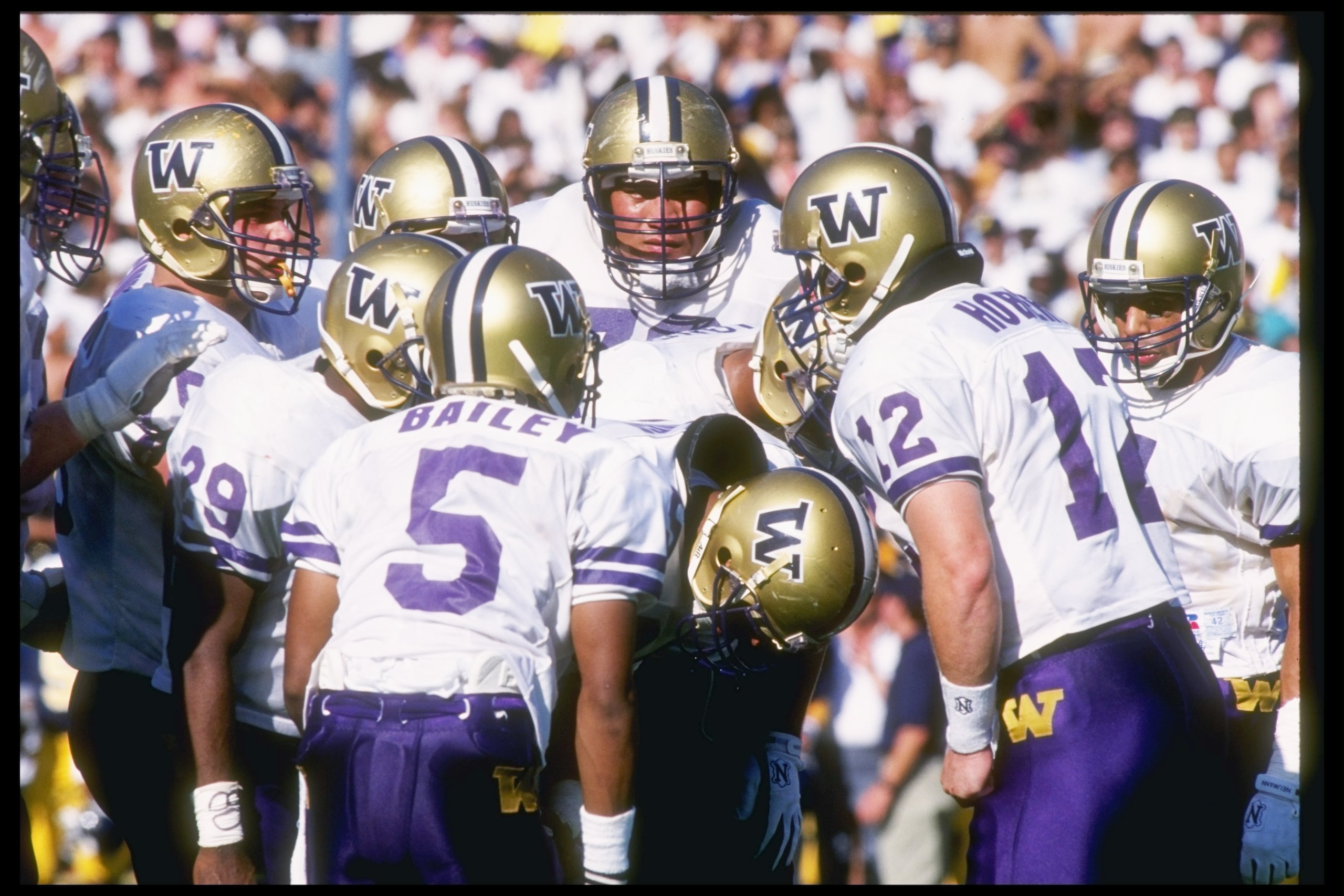 19 Oct 1991:  University of Washington Huskies quarterback Billy Joe Hobert calls out the play in the huddle during game against the University of California Golden Bears at Memorial Stadium in Berkeley, California.  The University of Washington won the g