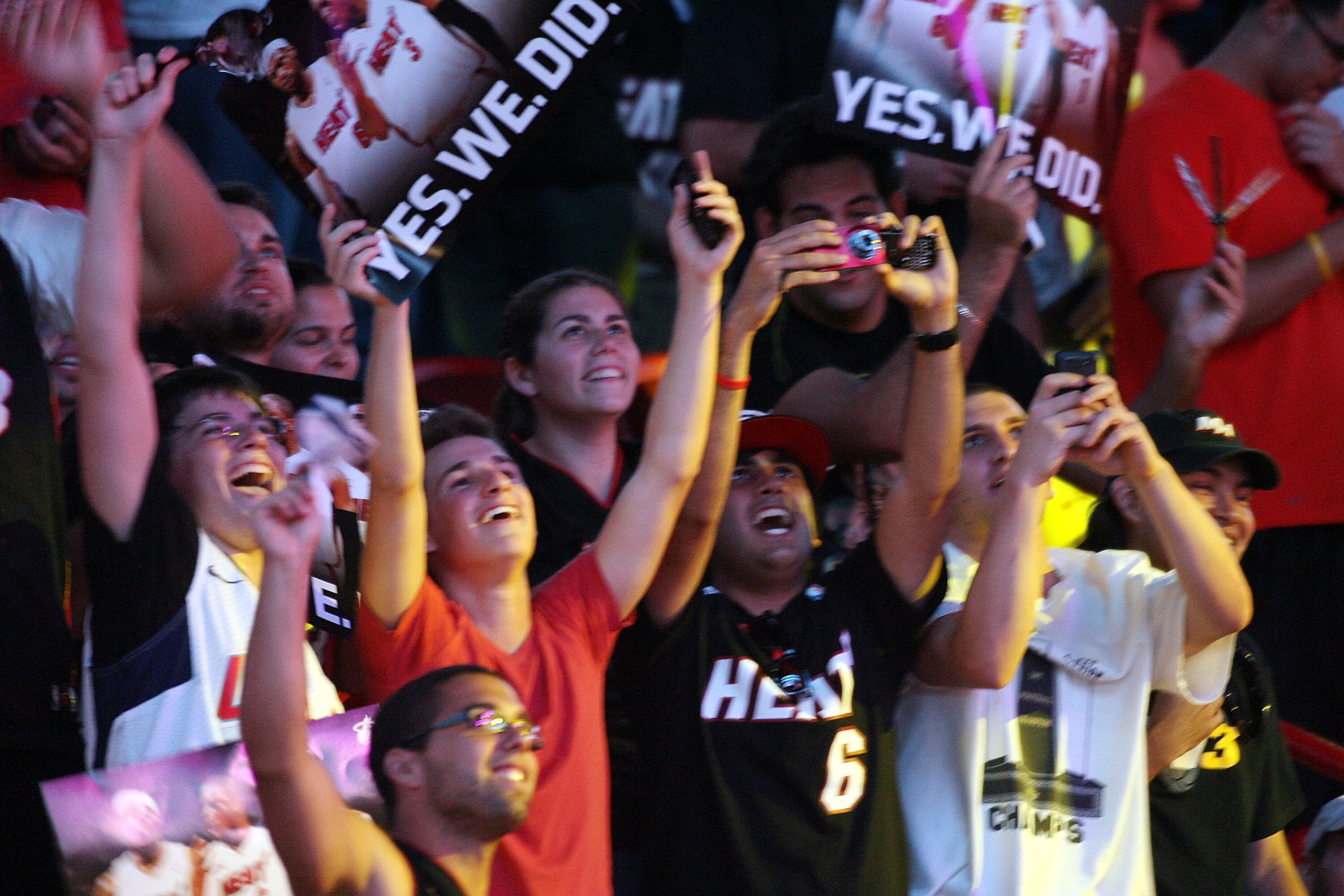 MIAMI - JULY 09:  Fans cheer as Chris Bosh #1, Dwyane Wade #3, and LeBron James #6 of the Miami Heat are introduced during a welcome party at American Airlines Arena on July 9, 2010 in Miami, Florida.  (Photo by Marc Serota/Getty Images)