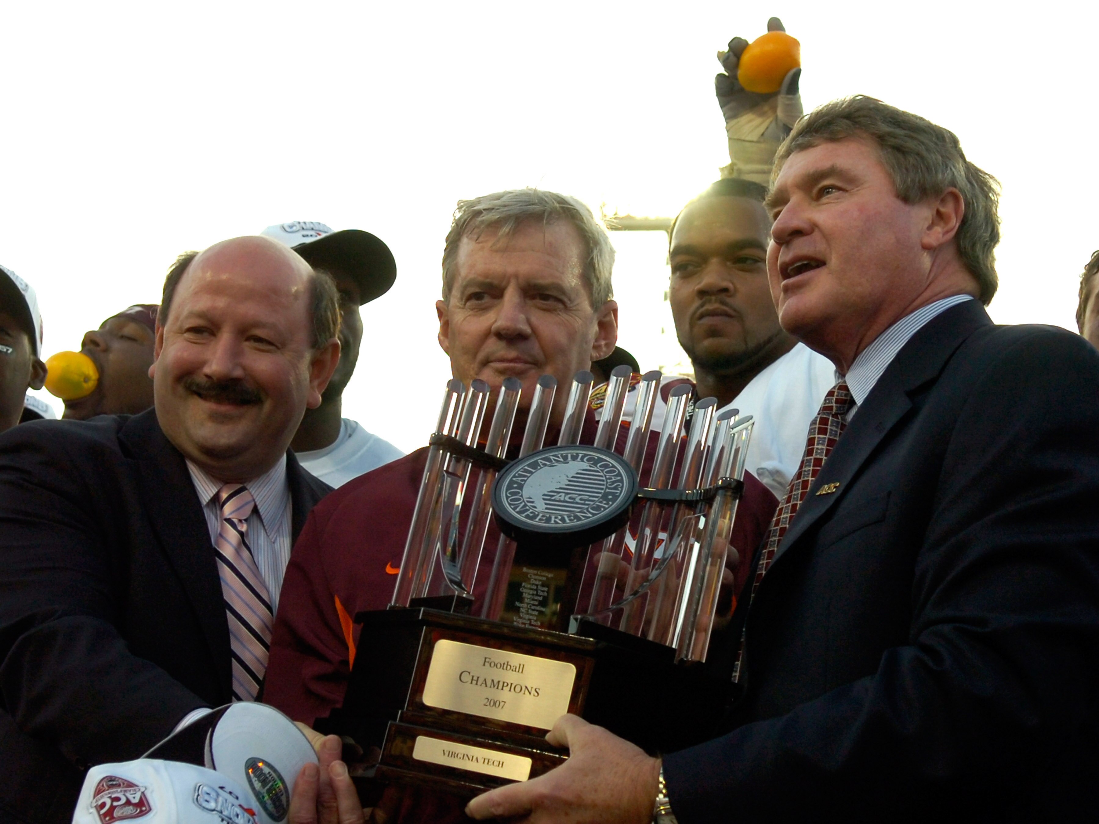 JACKSONVILLE, FL - DECEMBER 1:  Coach Frank Beamer (C) of the Virginia Tech Hokies holds the championship trophy after play against the Boston College Eagles in the ACC Championship Game at Jacksonville Municipal Stadium on December 1, 2007 in Jacksonvill