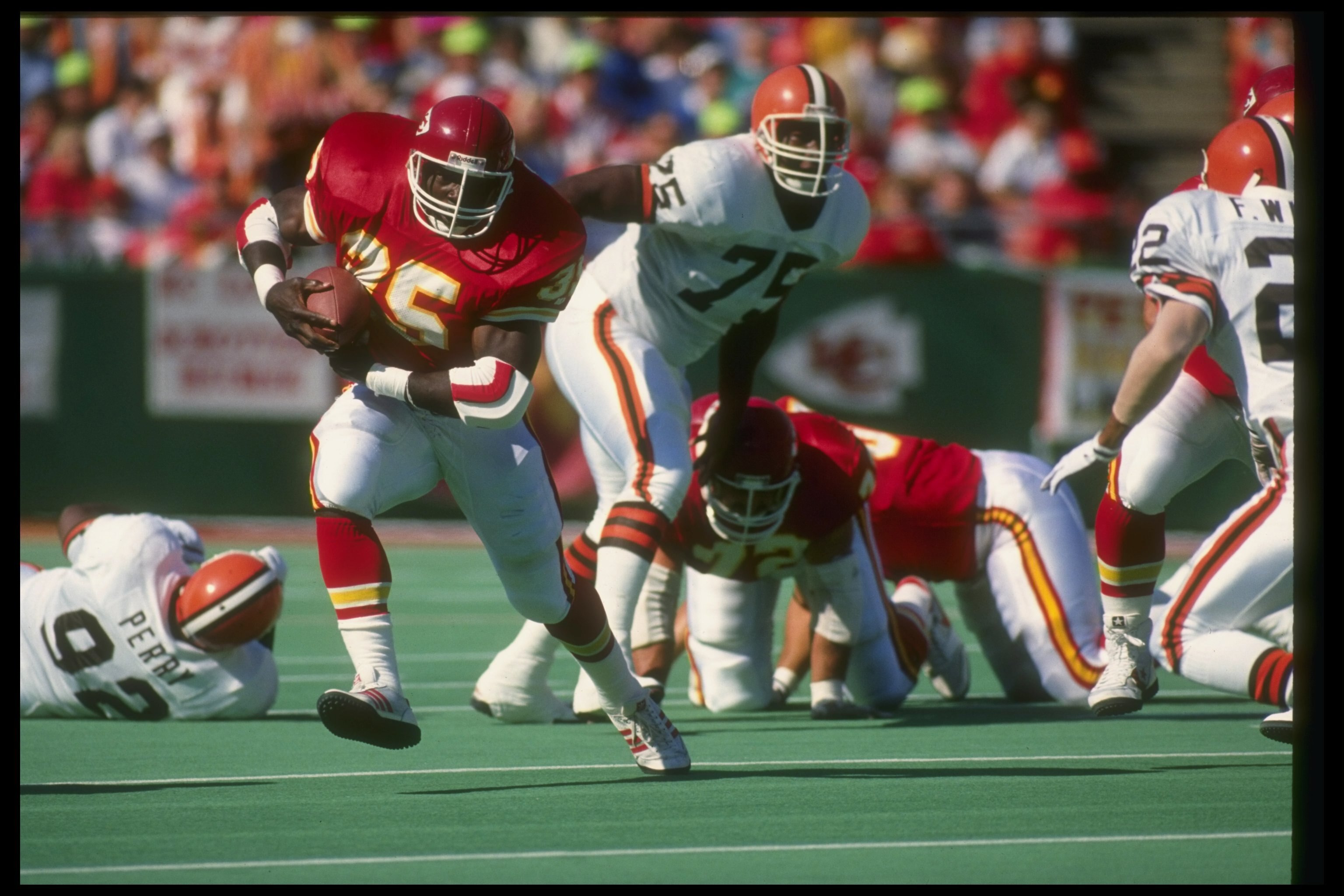 30 Sep 1990: Running back Christian Okoye of the Kansas City Chiefs (left) moves the ball during a game against the Cleveland Browns at Arrowhead Stadium in Kansas City, Missouri. The Chiefs won the game, 34-0.