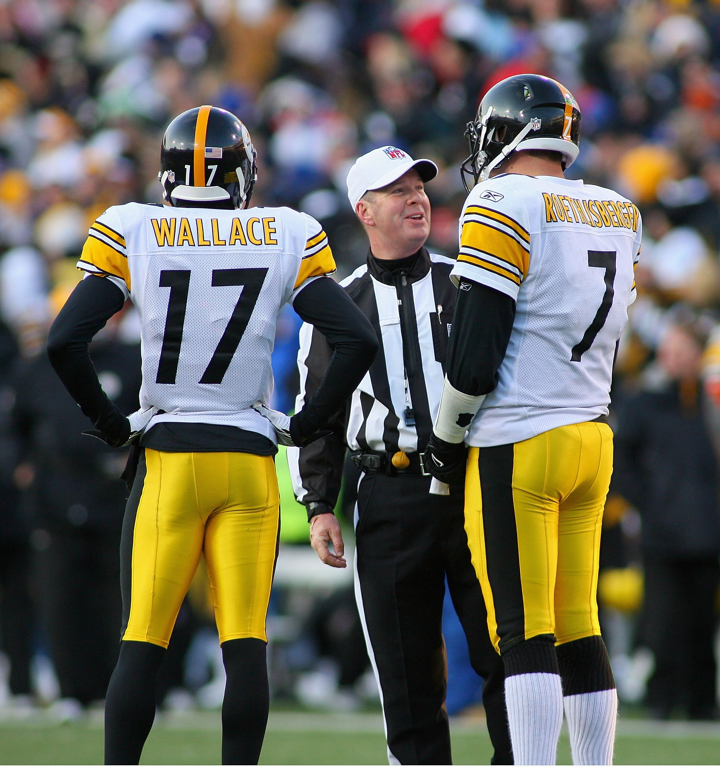 ORCHARD PARK, NY - NOVEMBER 28:  Ben Roethlisberger #7 and Mike Wallace #17 of the Pittsburgh Steelers talk to referee John Parry #132 during a timeout against  the Buffalo Bills  at Ralph Wilson Stadium on November 28, 2010 in Orchard Park, New York. Pit