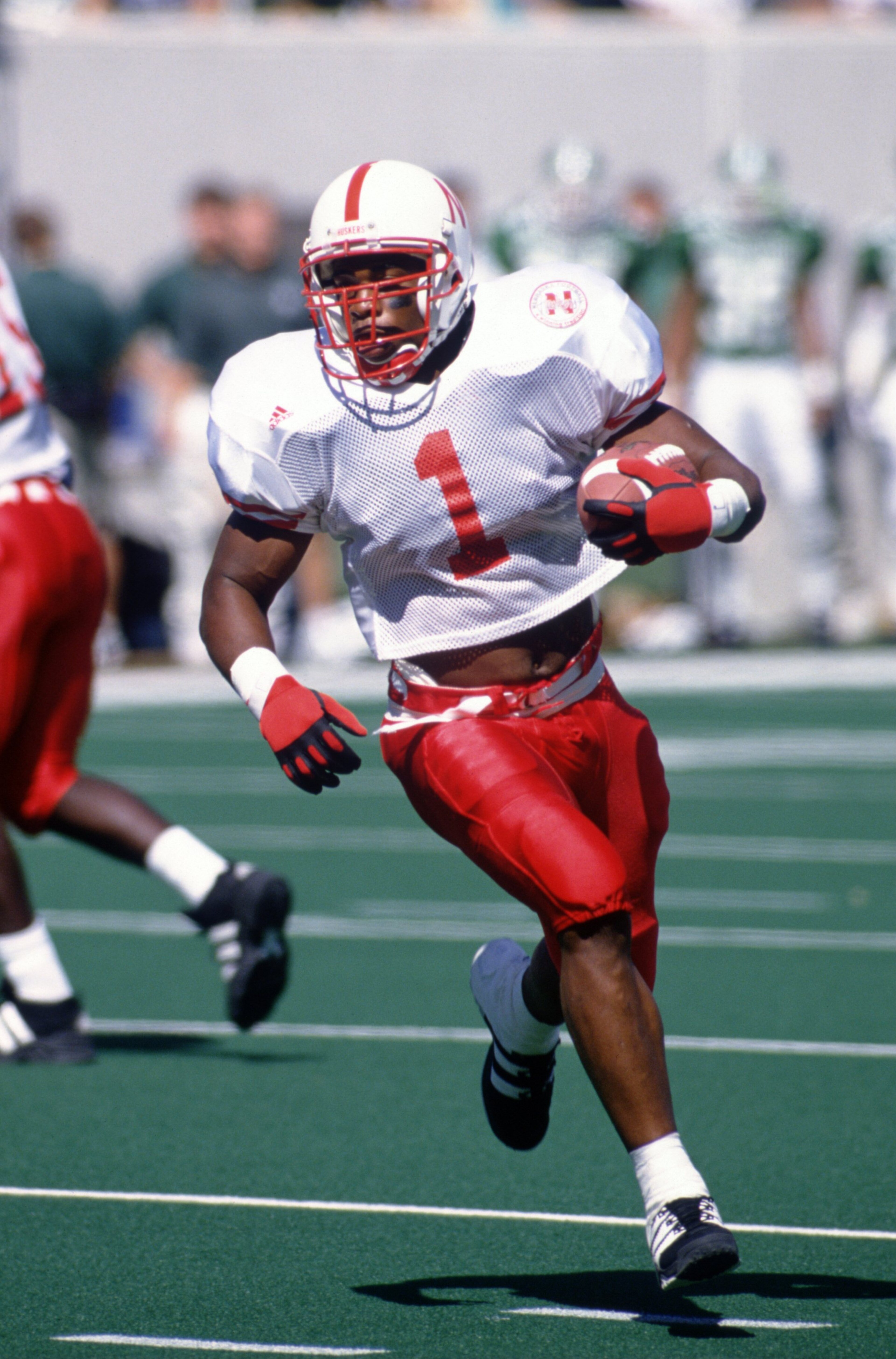 9 Sep 1995: Running back Lawrence Phillips of the University of Nebraska carries the football during the Cornhuskers 50-10 win over Michigan State at Spartan Stadium in East Lansing, Michigan. 9 Sep 1995: Running back Lawrence Phillips of the University of Nebraska carries the football during the Cornhuskers 50-10 win over Michigan State at Spartan Stadium in East Lansing, Michigan.