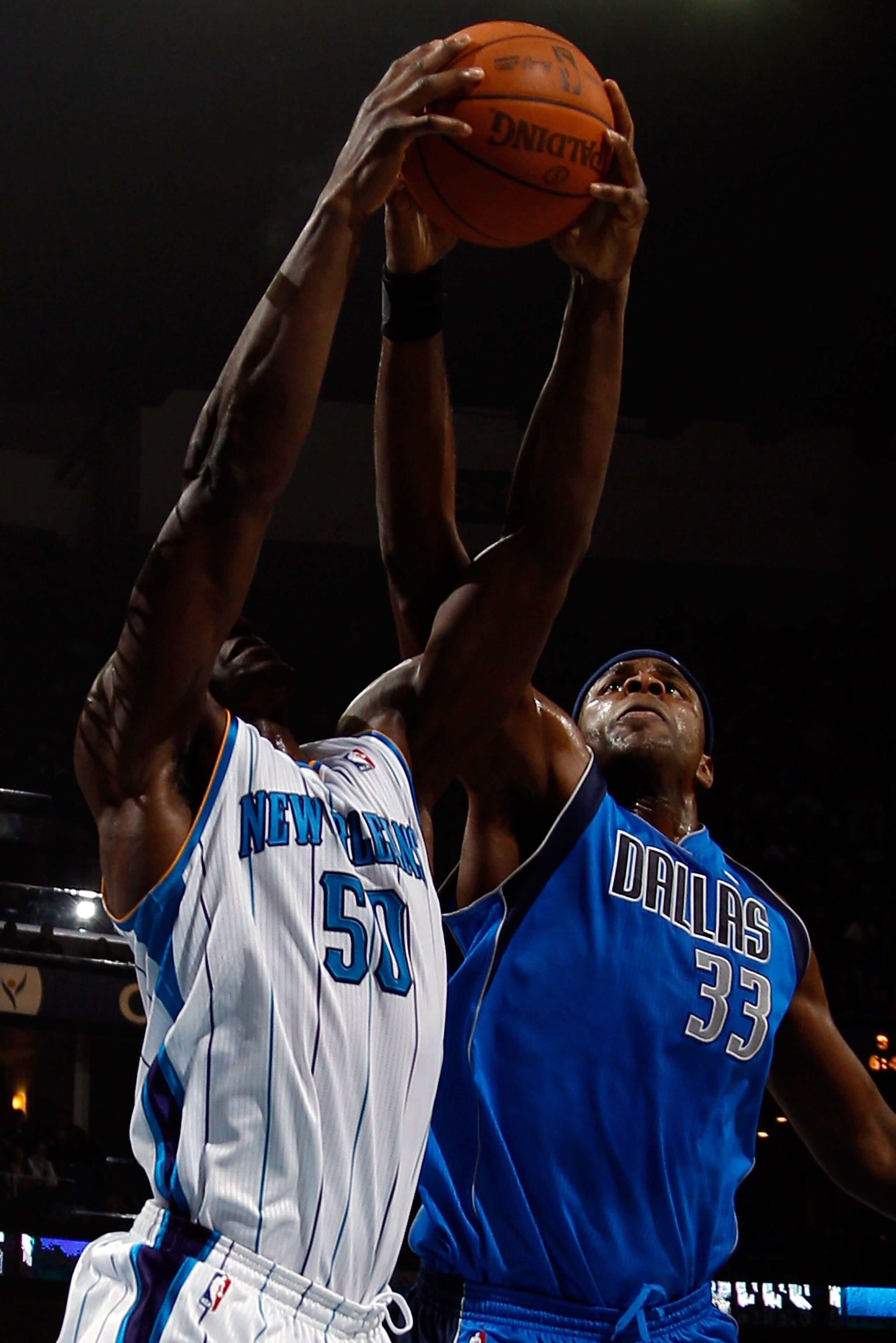 NEW ORLEANS - NOVEMBER 17: Emeka Okafor #50 of the New Orleans Hornets fights for a rebound with Brendan Haywood #33 of the Dallas Mavericks at the New Orleans Arena on November 17, 2010 in New Orleans, Louisiana. NOTE TO USER: User expressly acknowledg NEW ORLEANS - NOVEMBER 17: Emeka Okafor #50 of the New Orleans Hornets fights for a rebound with Brendan Haywood #33 of the Dallas Mavericks at the New Orleans Arena on November 17, 2010 in New Orleans, Louisiana. NOTE TO USER: User expressly acknowledg
