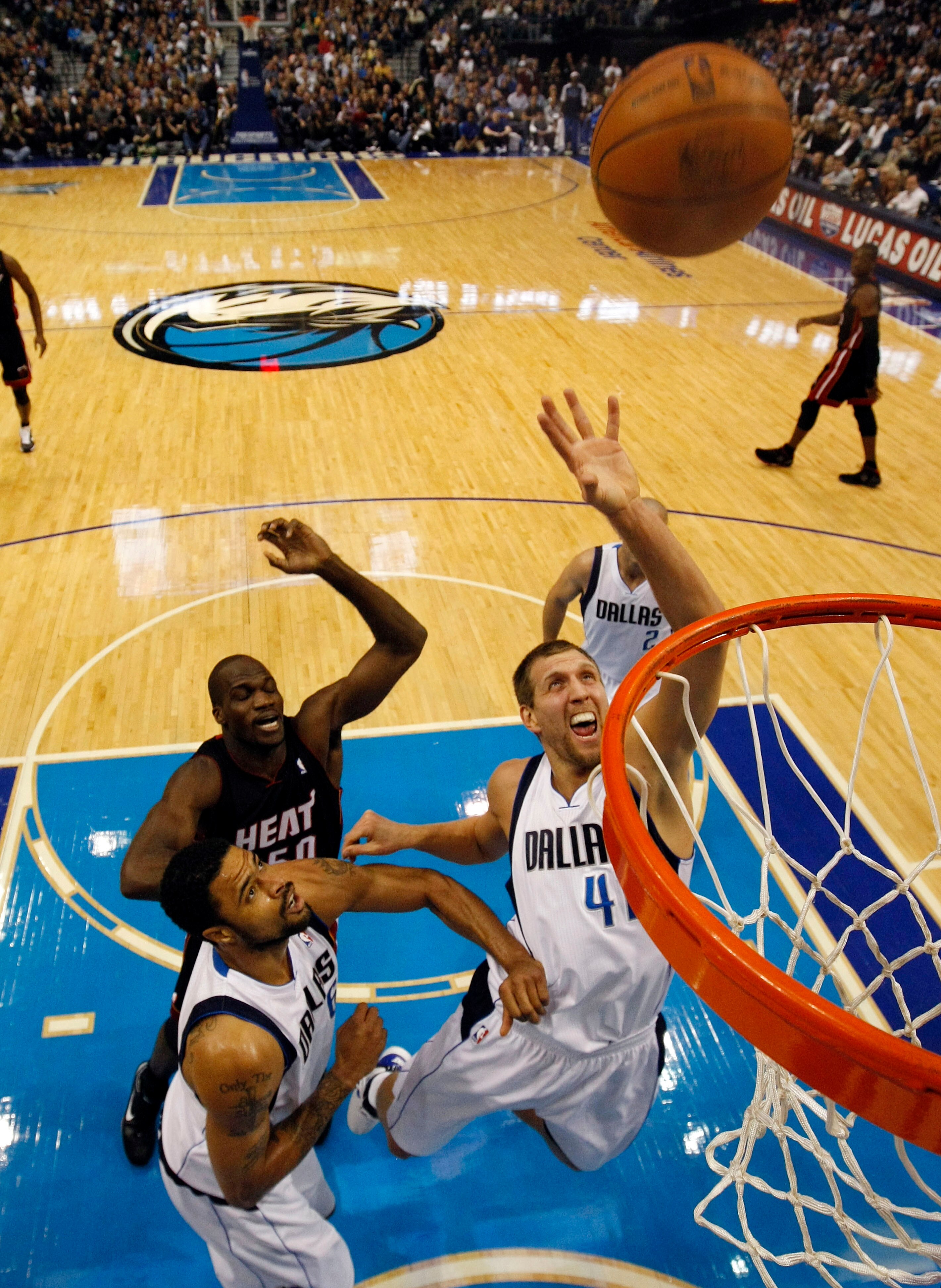 DALLAS - NOVEMBER 27: Dirk Nowitzki #41 of the Dallas Mavericks shoots against Joel Anthony #50 of the Miami Heat on November 27, 2010 at the American Airlines Center in Dallas, Texas. NOTE TO USER: User expressly acknowledges and agrees that, by download