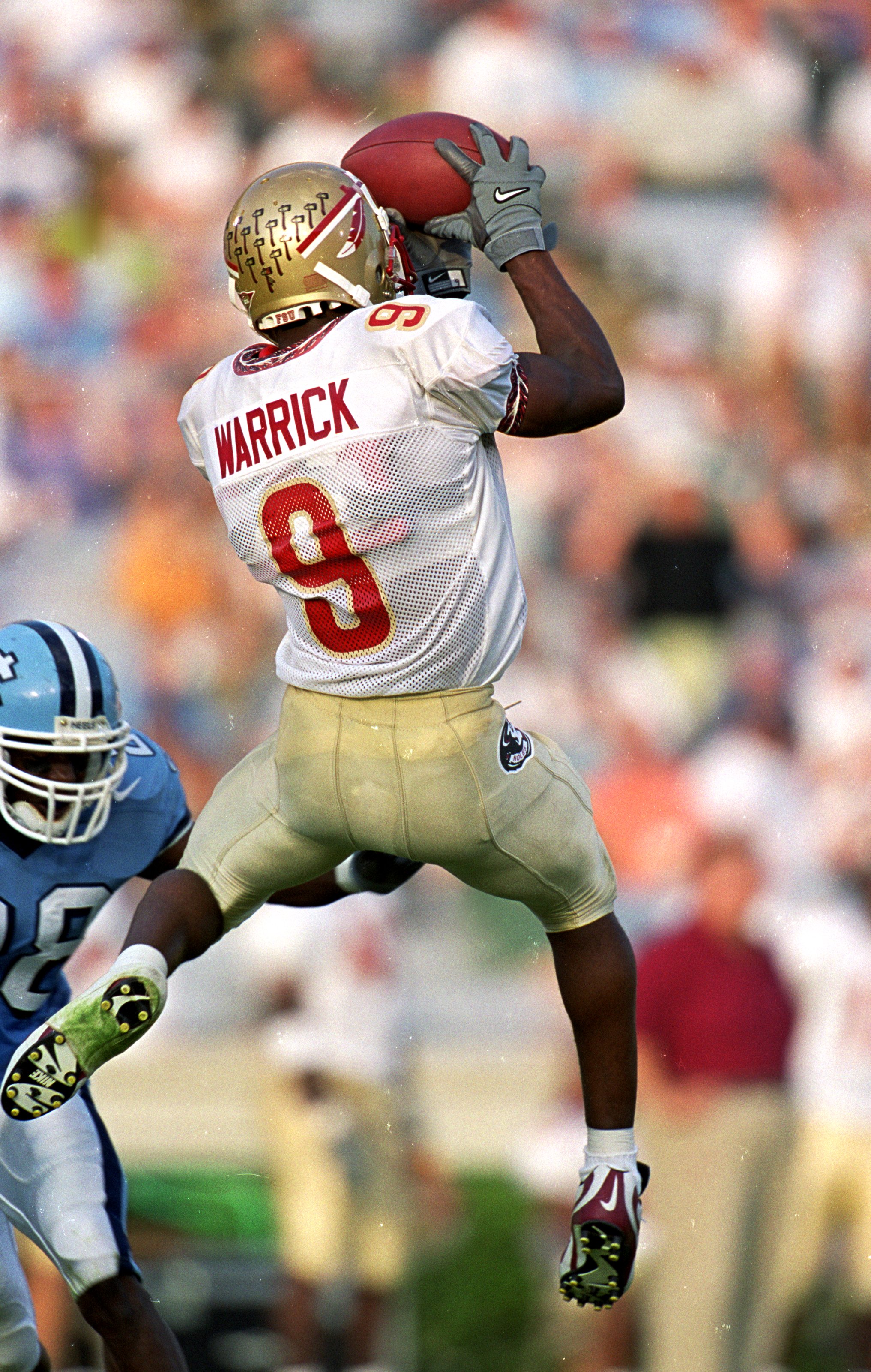 25 Sep 1999: Peter Warrick #9 of the Florida State Seminoles jumps to catch the ball during the game against the North Carolina Tar Heels at the Kenan Stadium in Chapel Hill, North Carolina. The Seminoles defeated the Tar Heels 42-10.