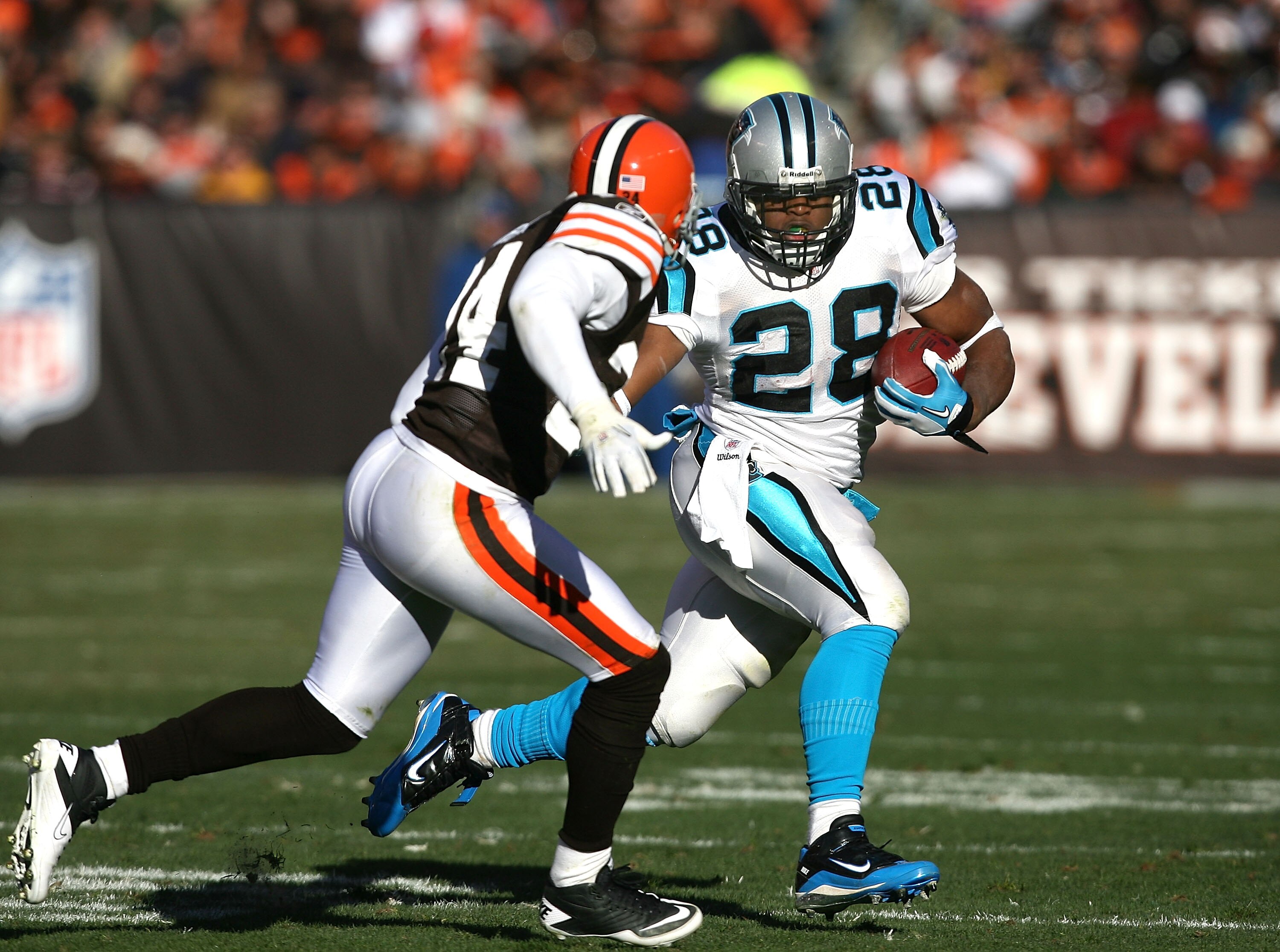 CLEVELAND - NOVEMBER 28:  Running back Jonathan Stewart #28 of the Carolina Panthers runs by defensive back Sheldon Brown #24 of the Cleveland Browns at Cleveland Browns Stadium on November 28, 2010 in Cleveland, Ohio.  (Photo by Matt Sullivan/Getty Image