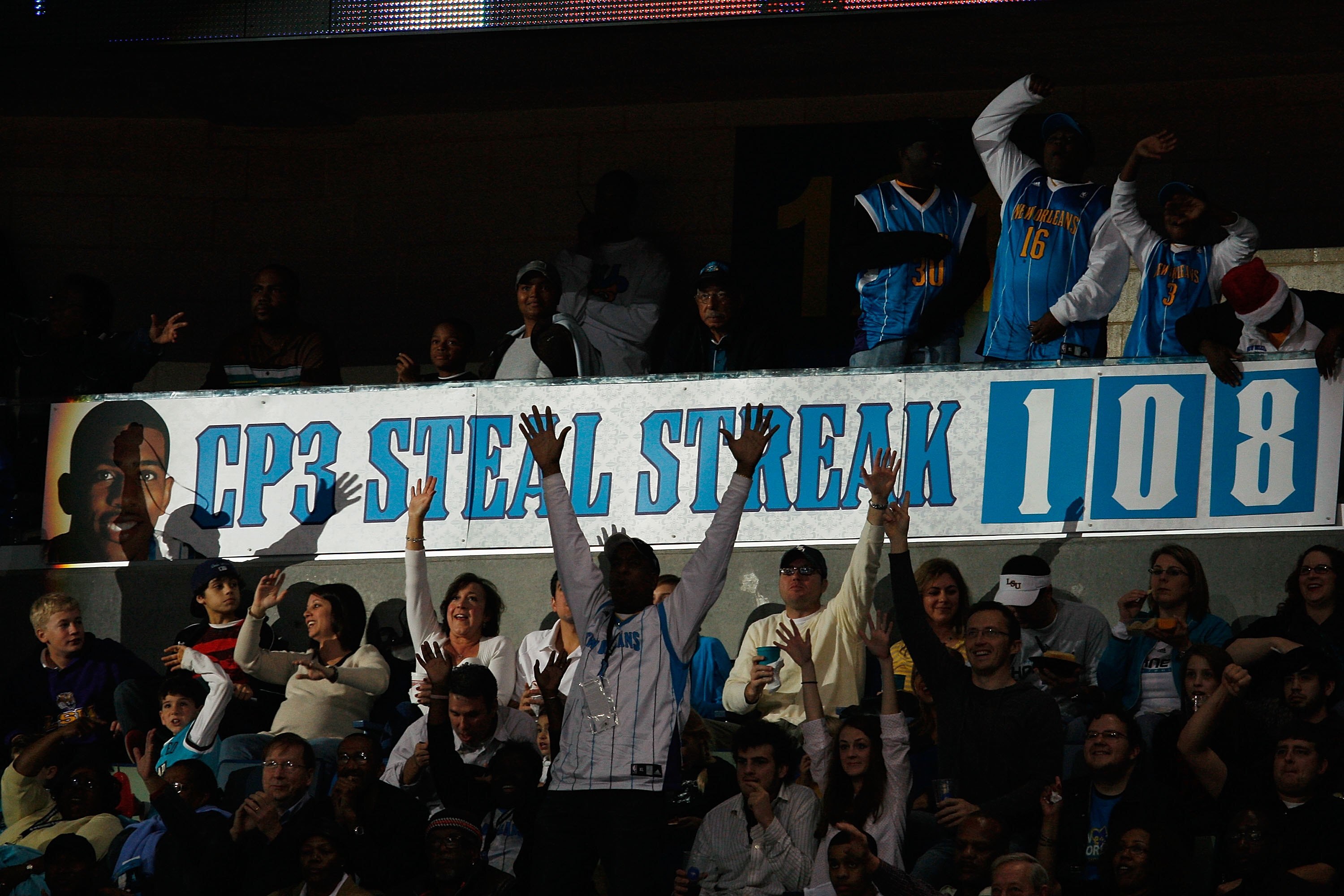 NEW ORLEANS - DECEMBER 23:  Fans celebrate around a banner when Chris Paul #3 of the New Orleans Hornets breaks the consecutive steals streak (108) during the game against the San Antonio Spurs on December 17, 2008 at the New Orleans Arena in New Orleans,
