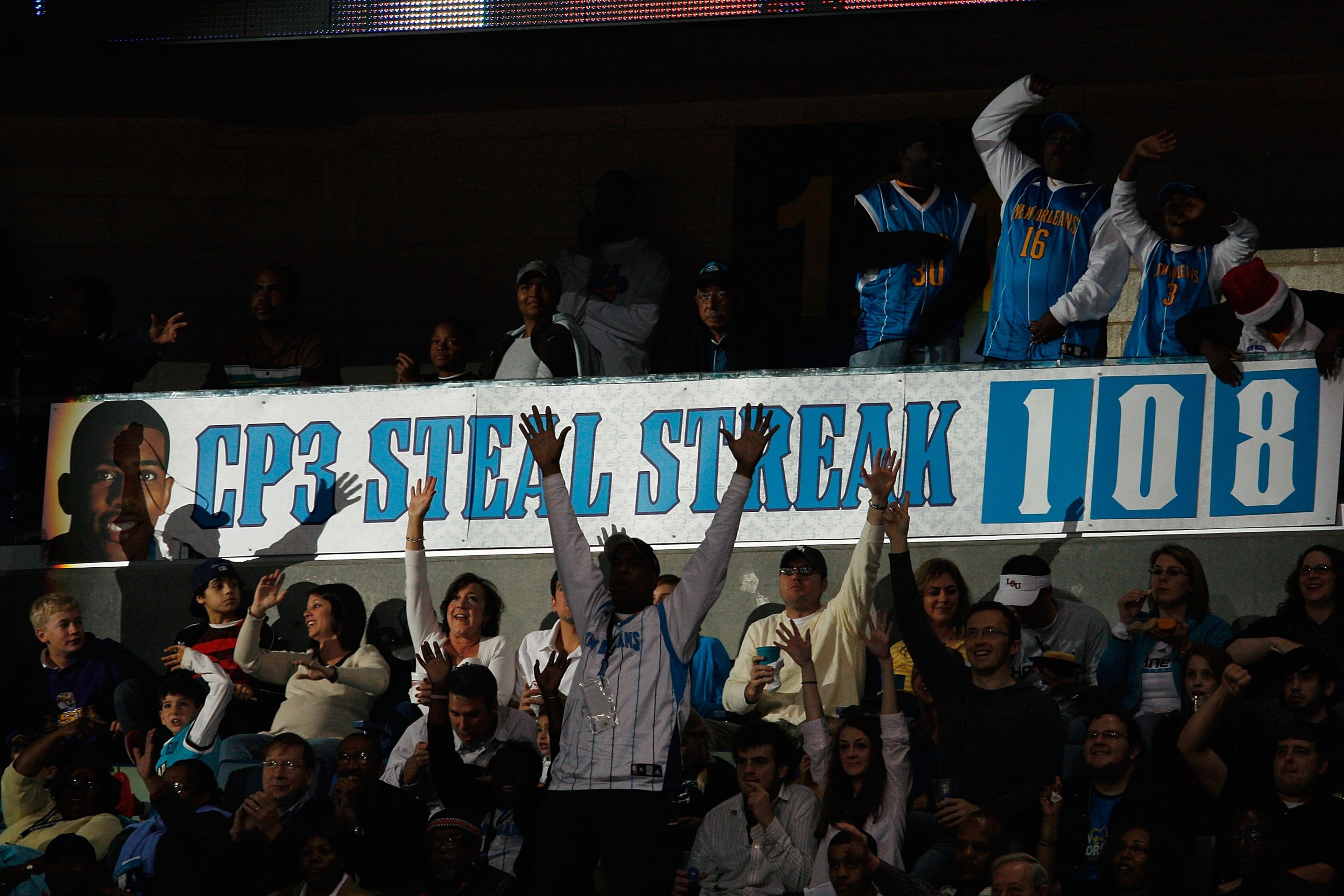 NEW ORLEANS - DECEMBER 23:  Fans celebrate around a banner when Chris Paul #3 of the New Orleans Hornets breaks the consecutive steals streak (108) during the game against the San Antonio Spurs on December 17, 2008 at the New Orleans Arena in New Orleans,